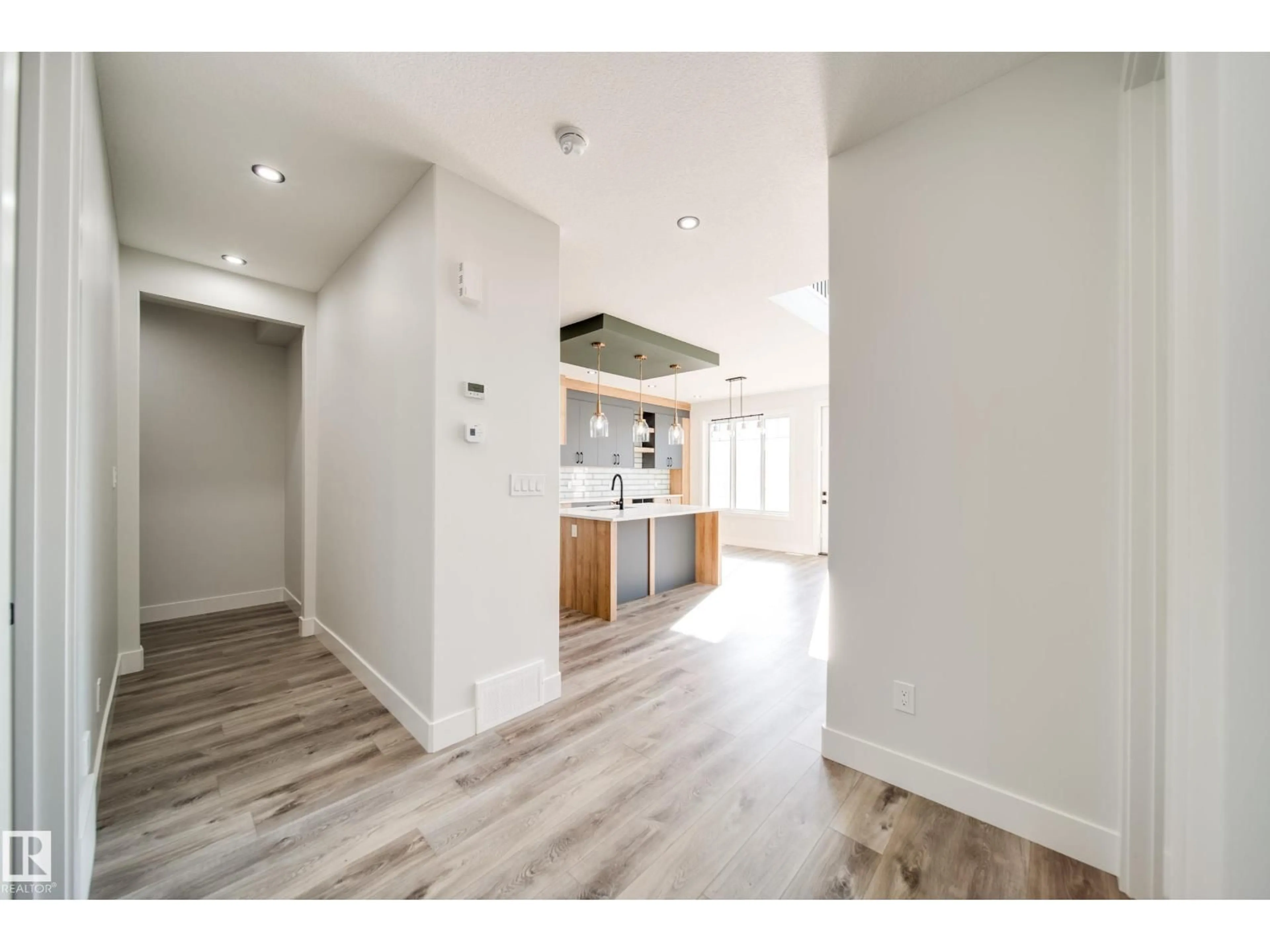 Open concept kitchen, wood/laminate floor for 8515 183 AV, Edmonton Alberta T5Z0X5