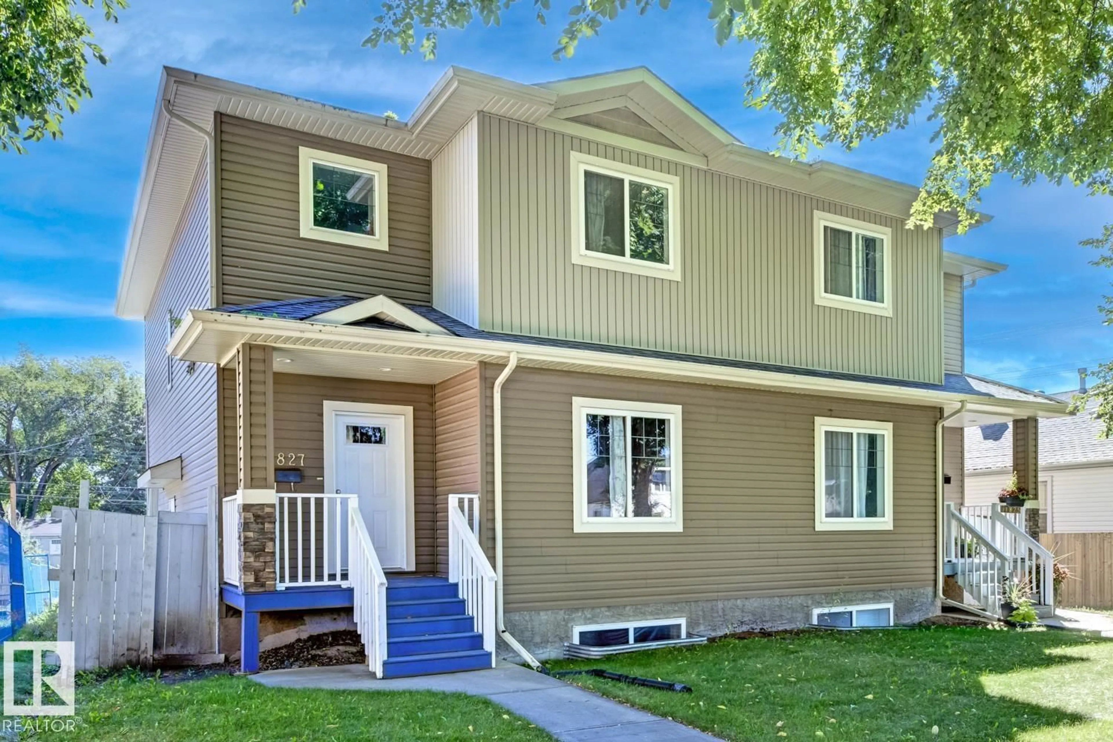 Home with vinyl exterior material, street for NW - 11827 56 ST, Edmonton Alberta T5W3S7