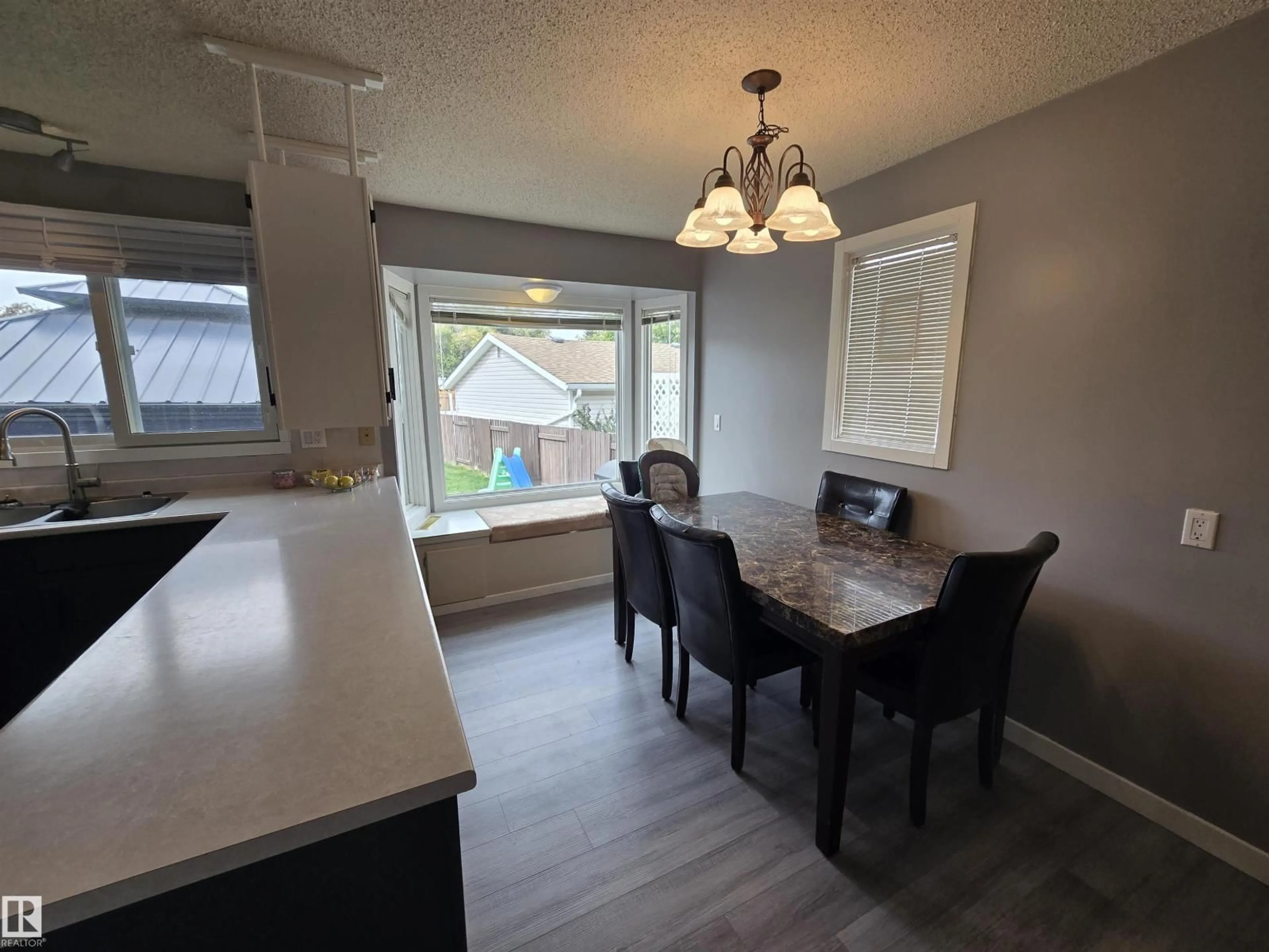 Dining room, wood/laminate floor for 33 ATHAPASKAN DR, Leduc Alberta T9E4E4