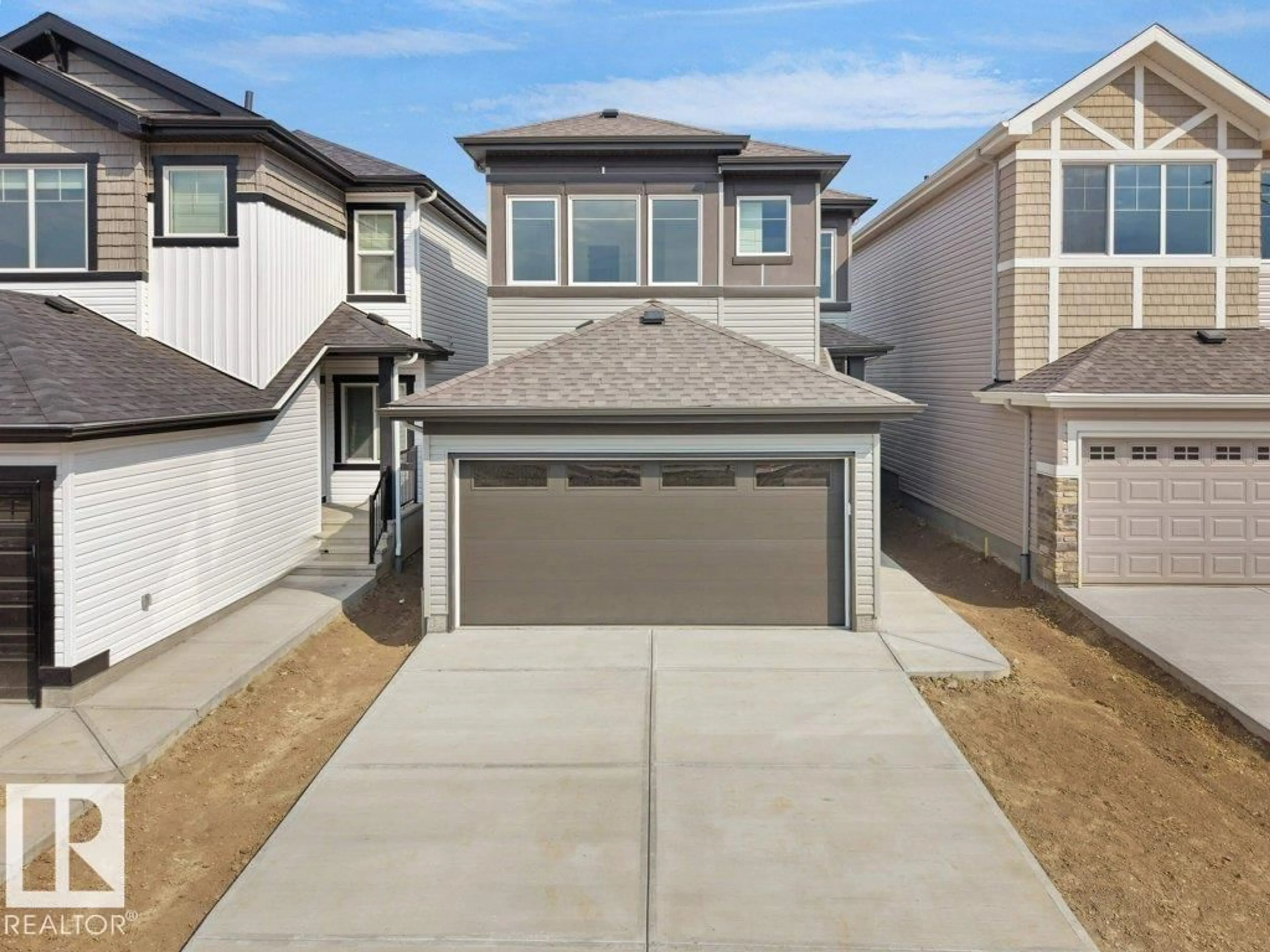 Home with vinyl exterior material, street for 912 17 AVE NW, Edmonton Alberta T6T2X8