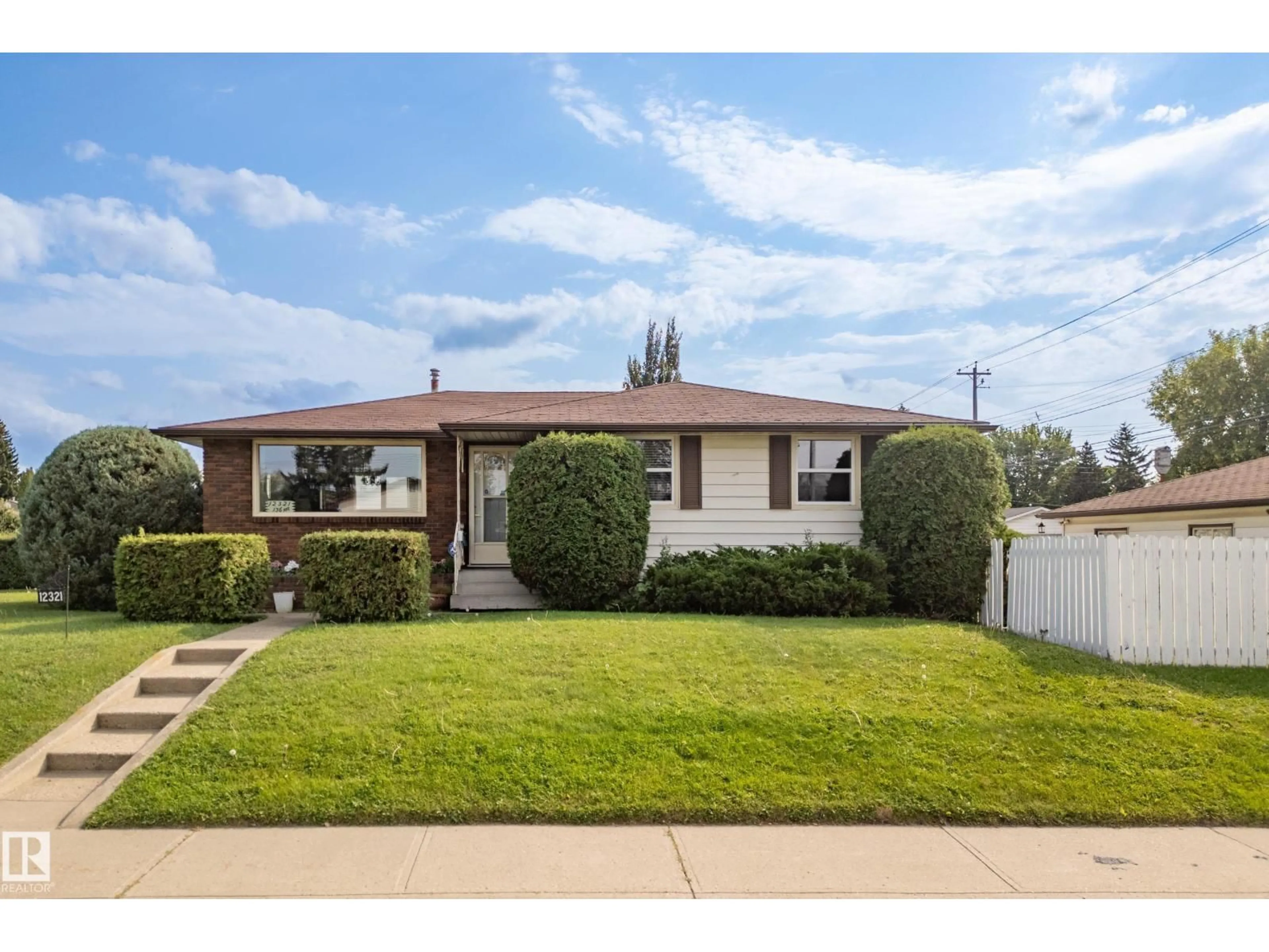 Home with vinyl exterior material, street for 12321 136 AV, Edmonton Alberta T5L4A7