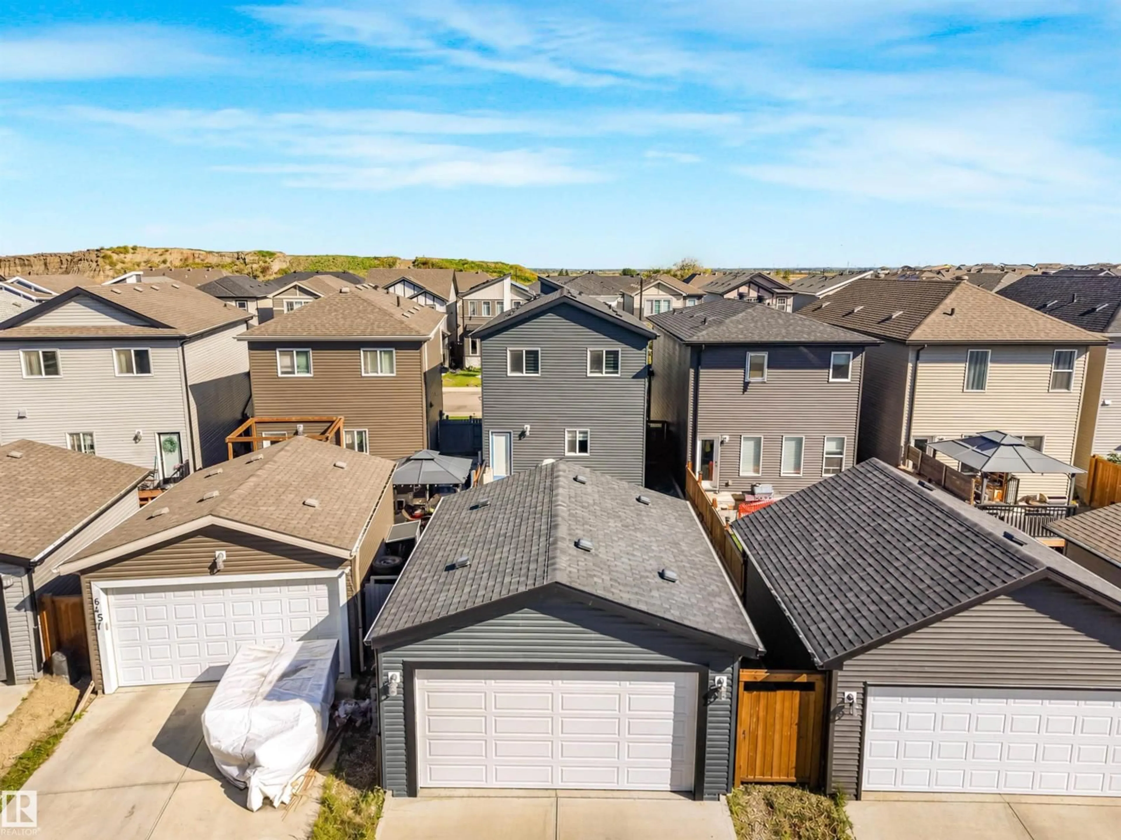 A pic from outside/outdoor area/front of a property/back of a property/a pic from drone, street for 6453 177A AV, Edmonton Alberta T5Y3X2