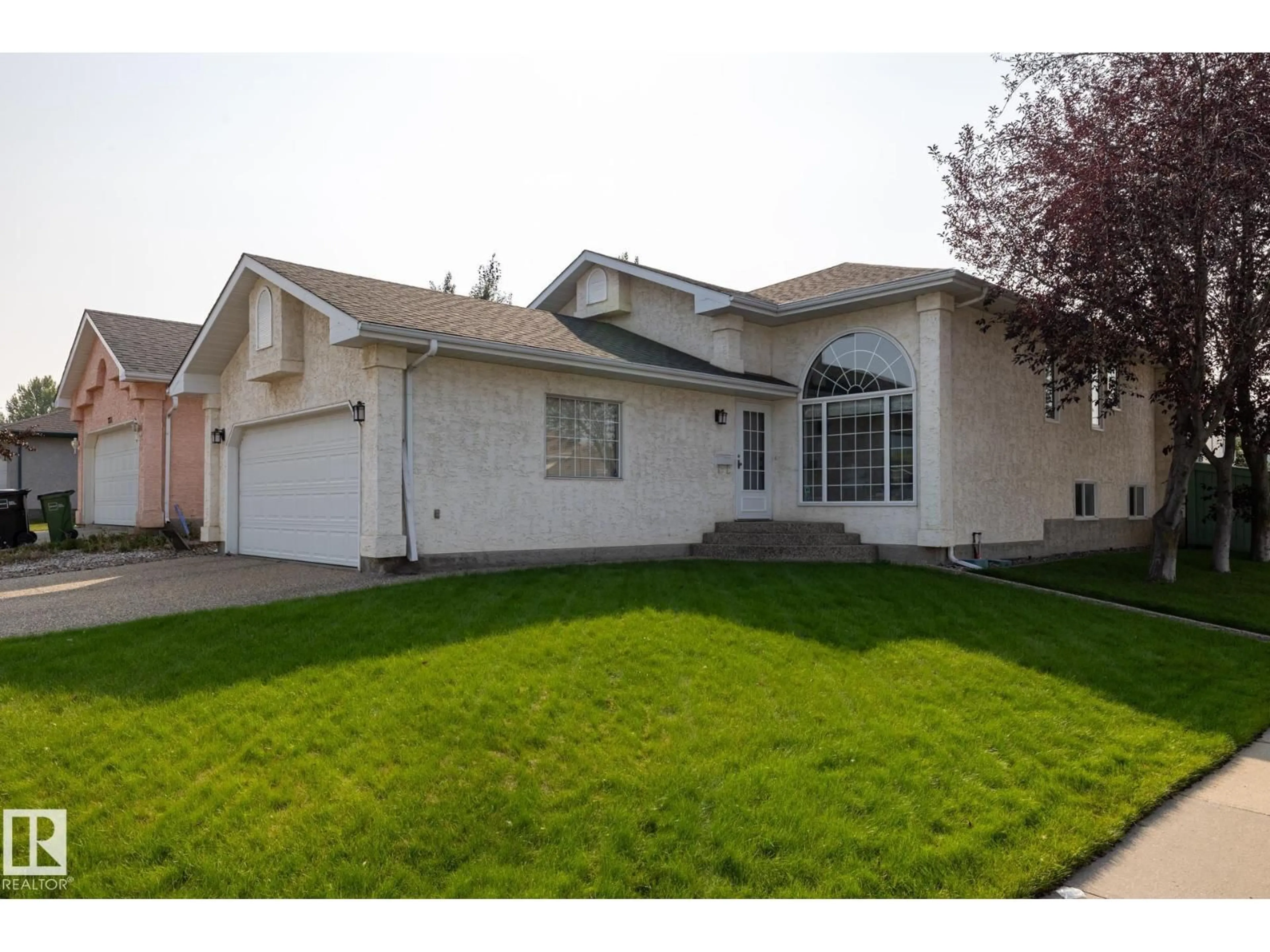 Home with vinyl exterior material, street for NW - 7232 189 ST, Edmonton Alberta T5T5W5