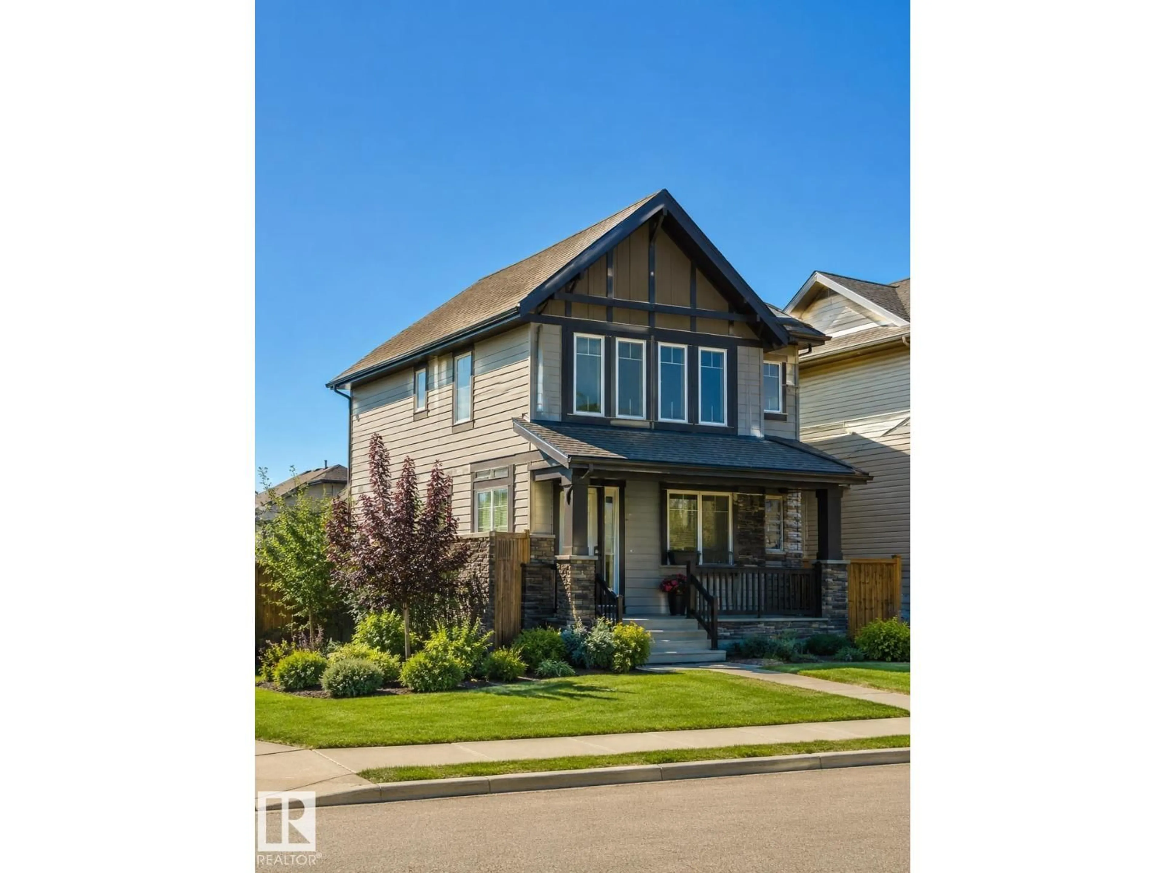 Home with vinyl exterior material, street for 604 TAMARACK RD, Edmonton Alberta T5Z2M6