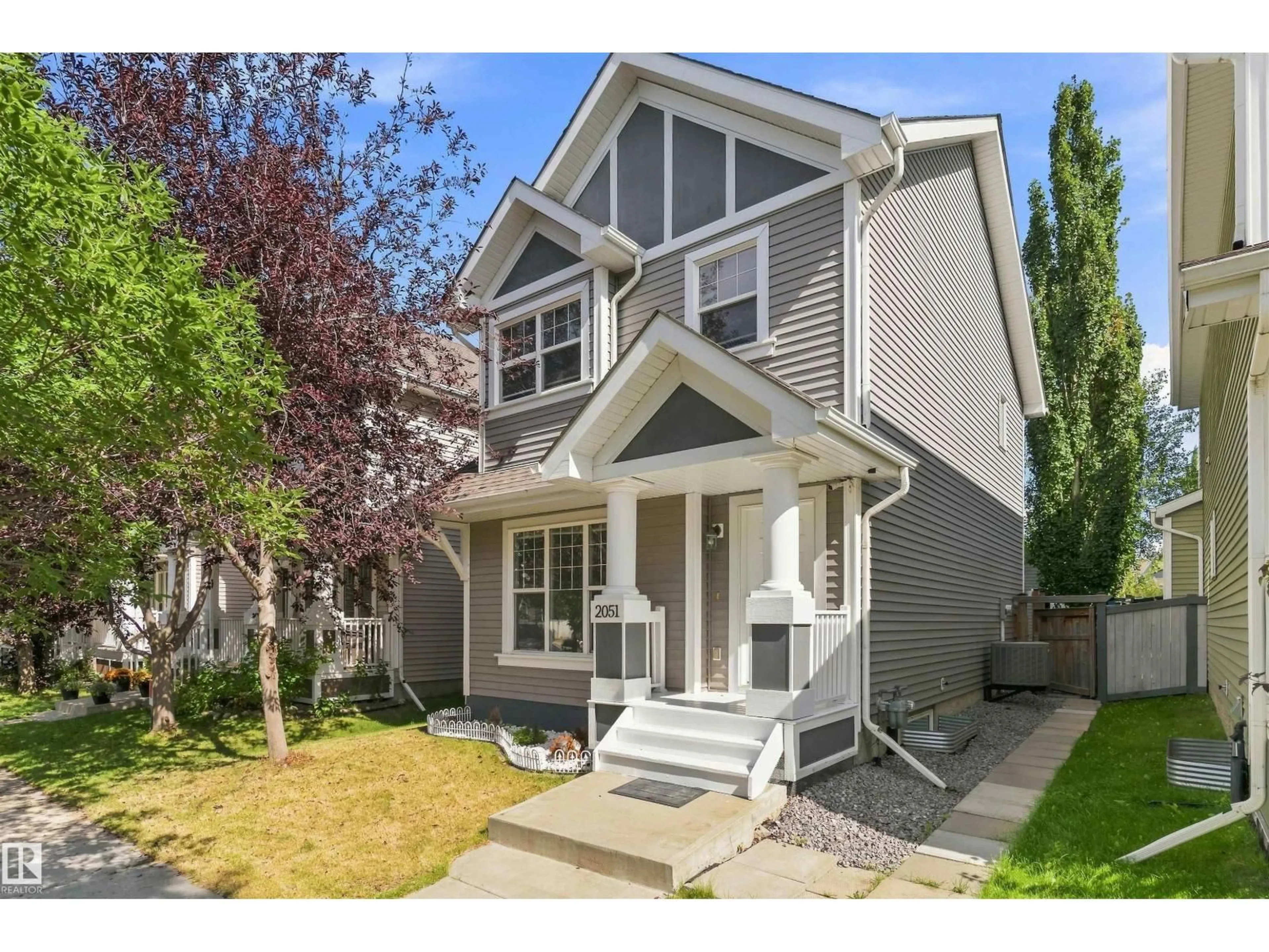 Home with vinyl exterior material, street for 2051 74 ST, Edmonton Alberta T6X0V7
