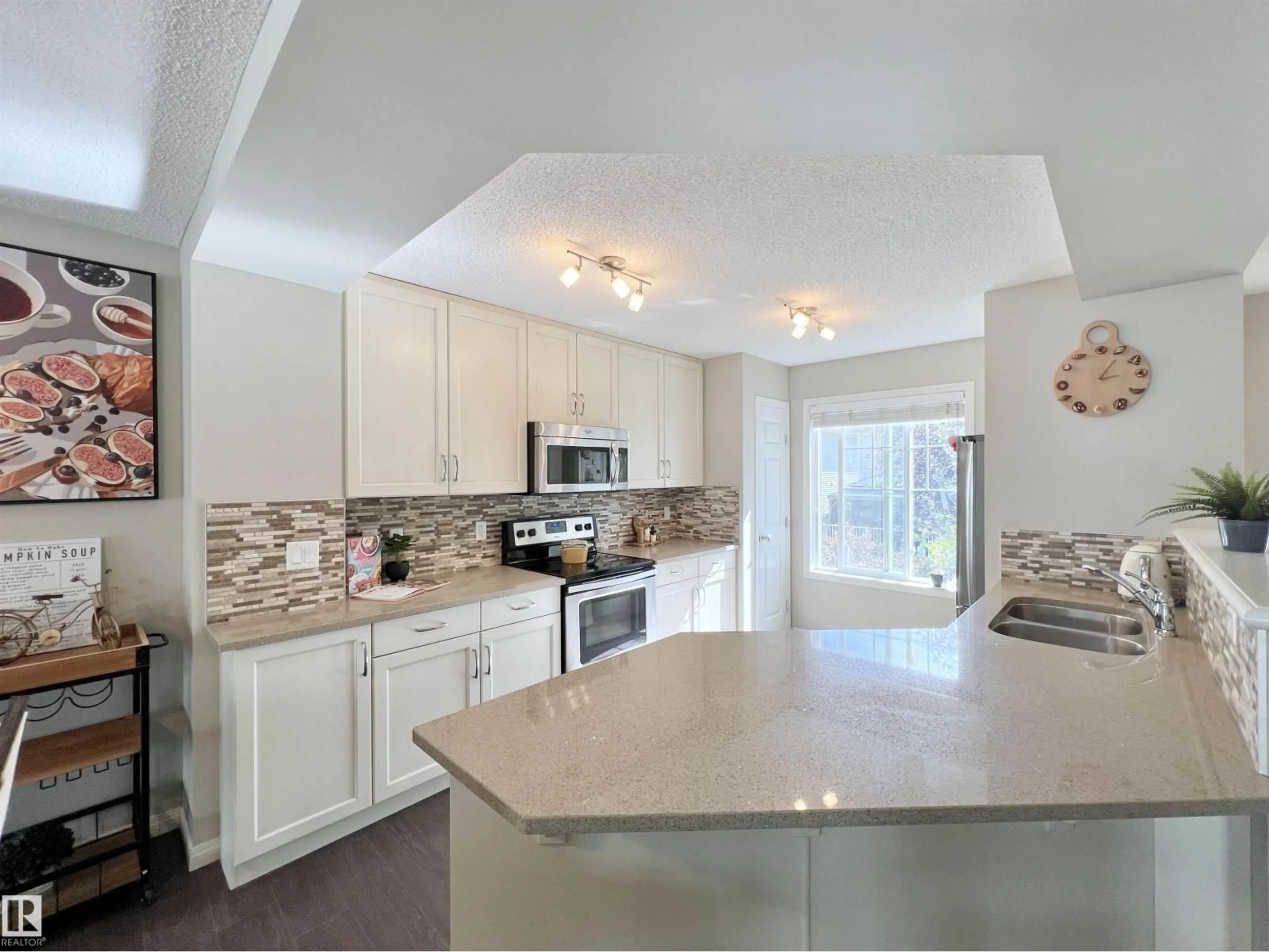 Open concept kitchen, ceramic/tile floor for 35 - 7385 EDGEMONT WY, Edmonton Alberta T6M0R9