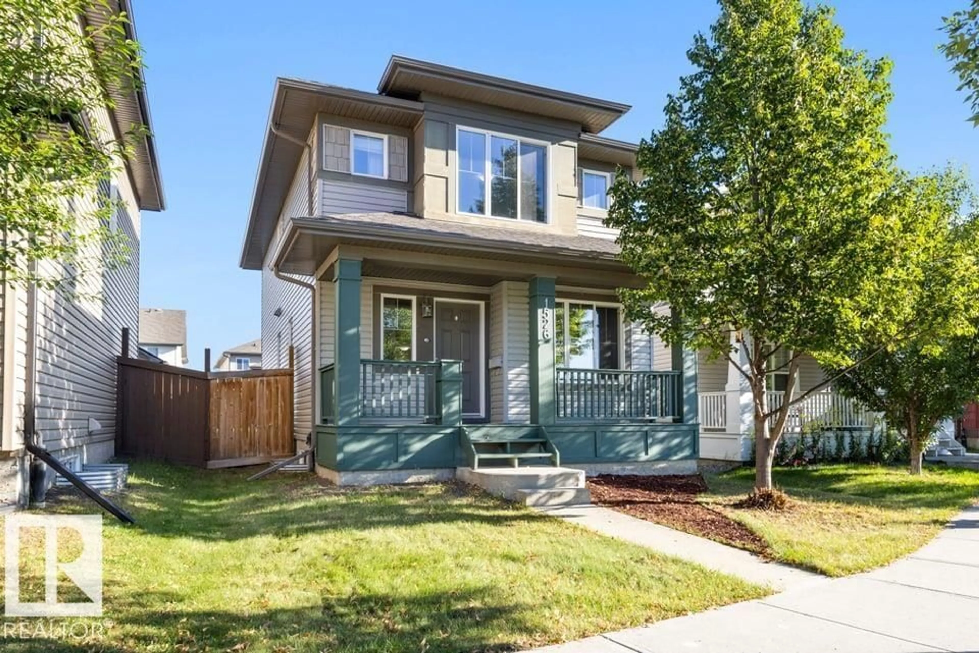 Home with vinyl exterior material, street for NW - 1526 35B AV, Edmonton Alberta T6T0M7