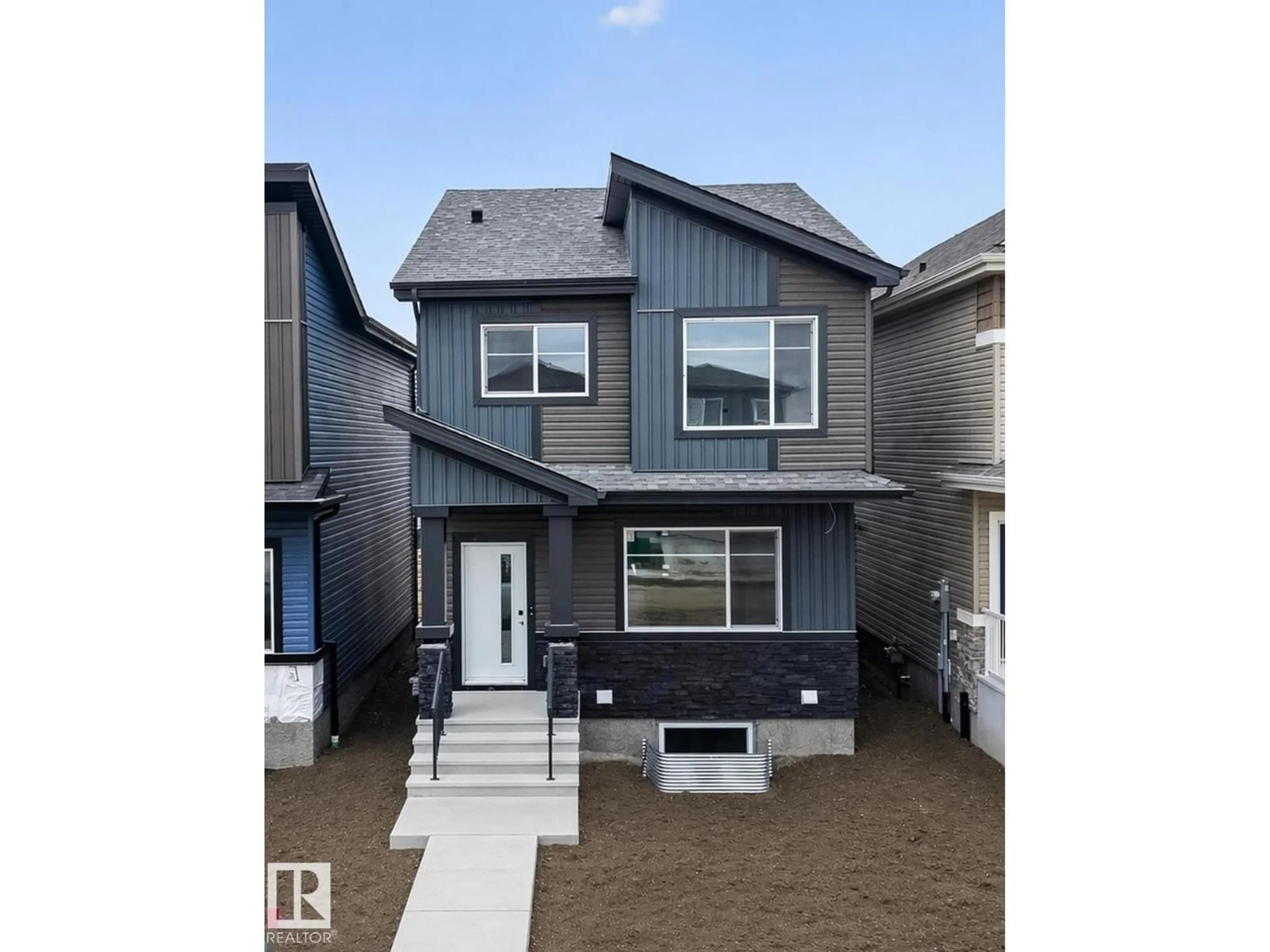 Home with vinyl exterior material, street for 217 WATTLE RD, Leduc Alberta T9E0V1