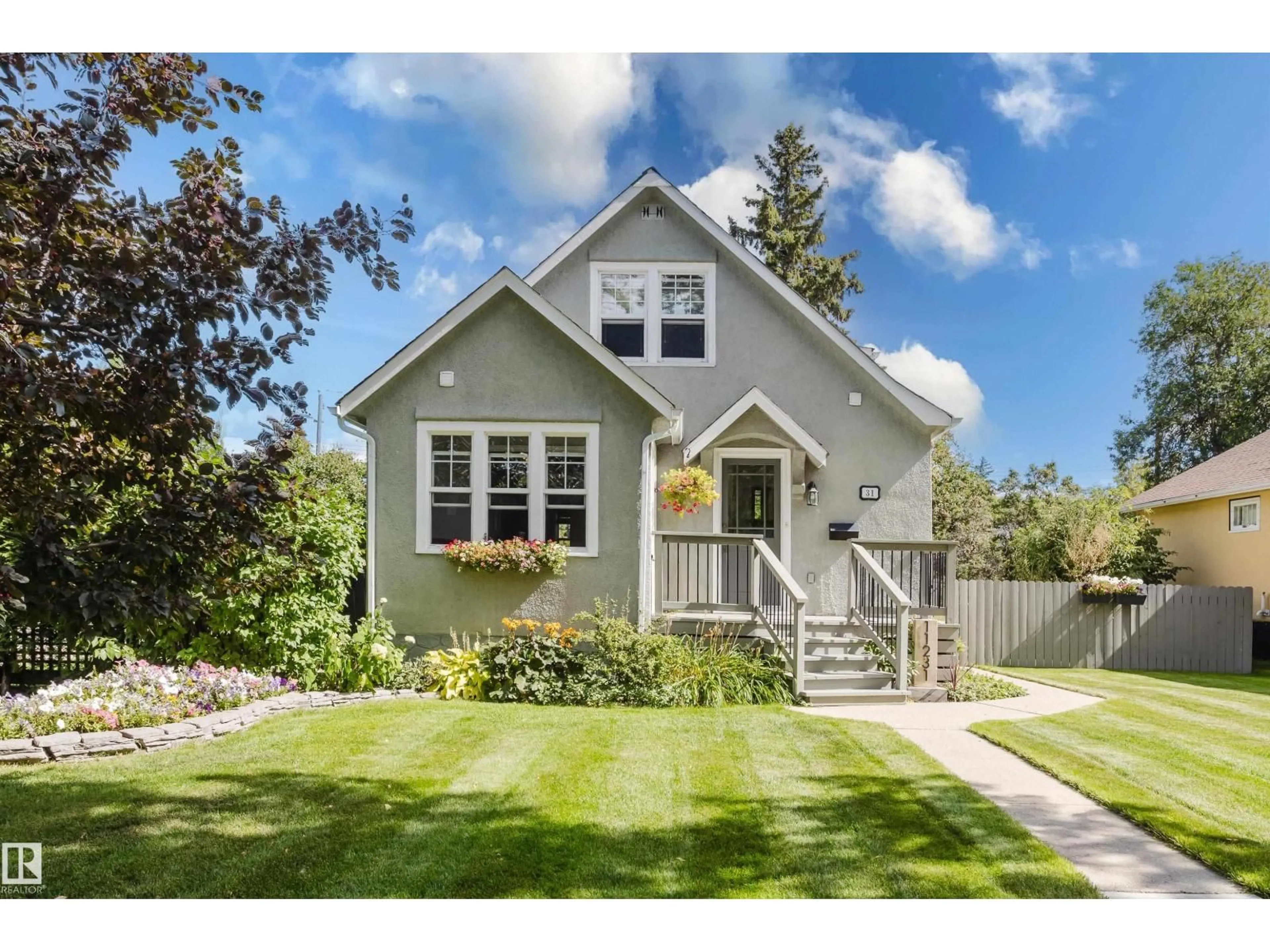 Home with vinyl exterior material, street for 11231 126 ST, Edmonton Alberta T5M0R3