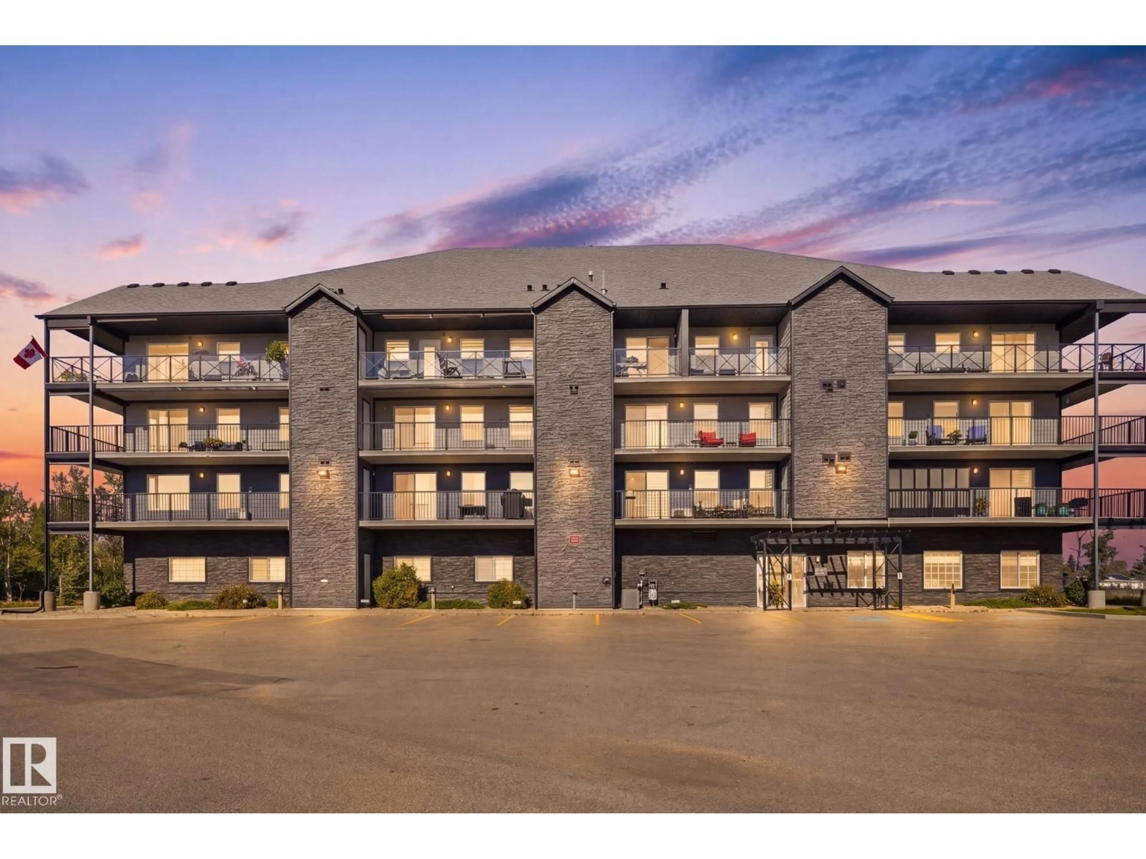 A pic from outside/outdoor area/front of a property/back of a property/a pic from drone, building for #408 - 4103 50 ST, Beaumont Alberta T4X2C7