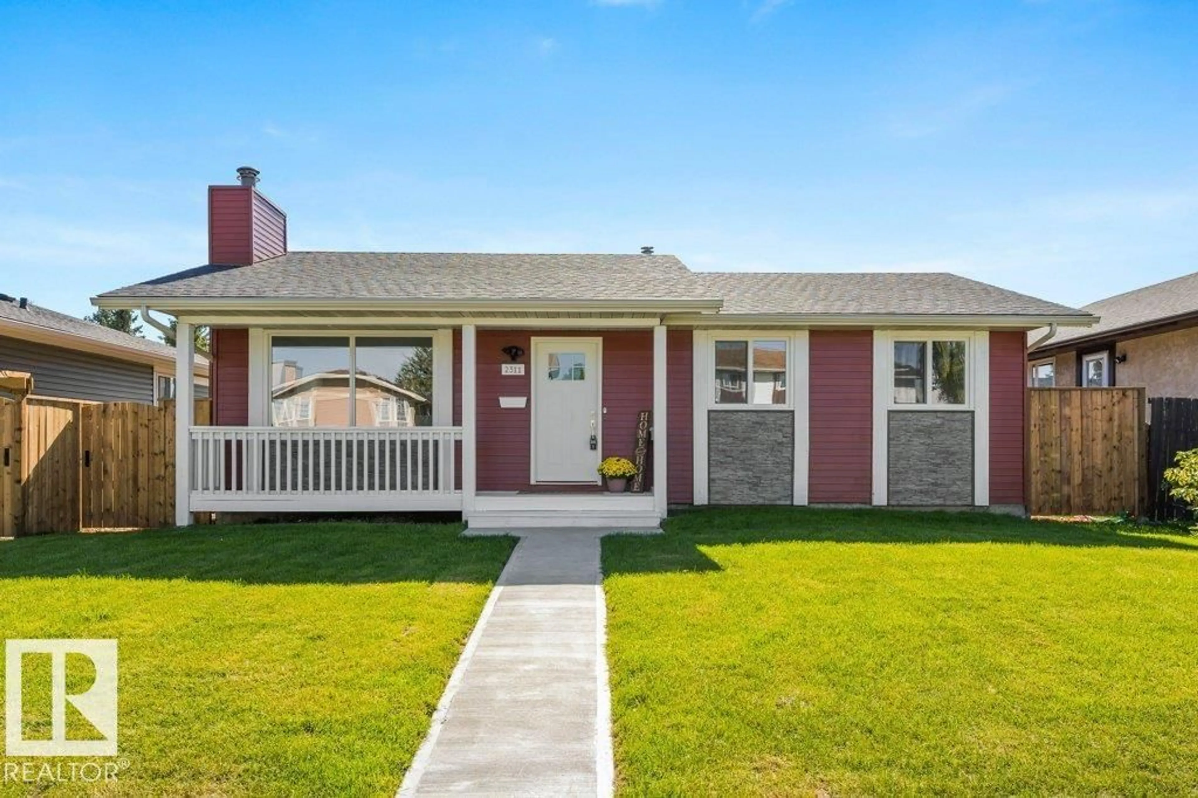 Home with vinyl exterior material, street for 2311 146 AV, Edmonton Alberta T5Y1W4