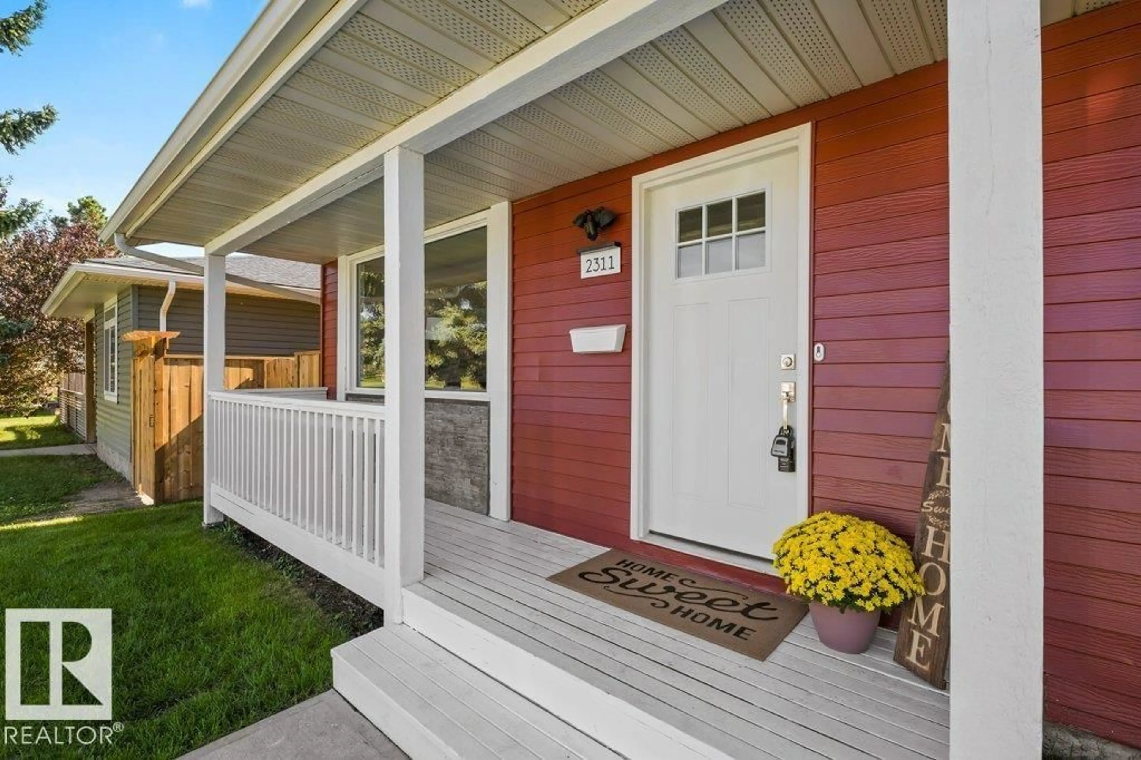 Home with vinyl exterior material, street for 2311 146 AV, Edmonton Alberta T5Y1W4