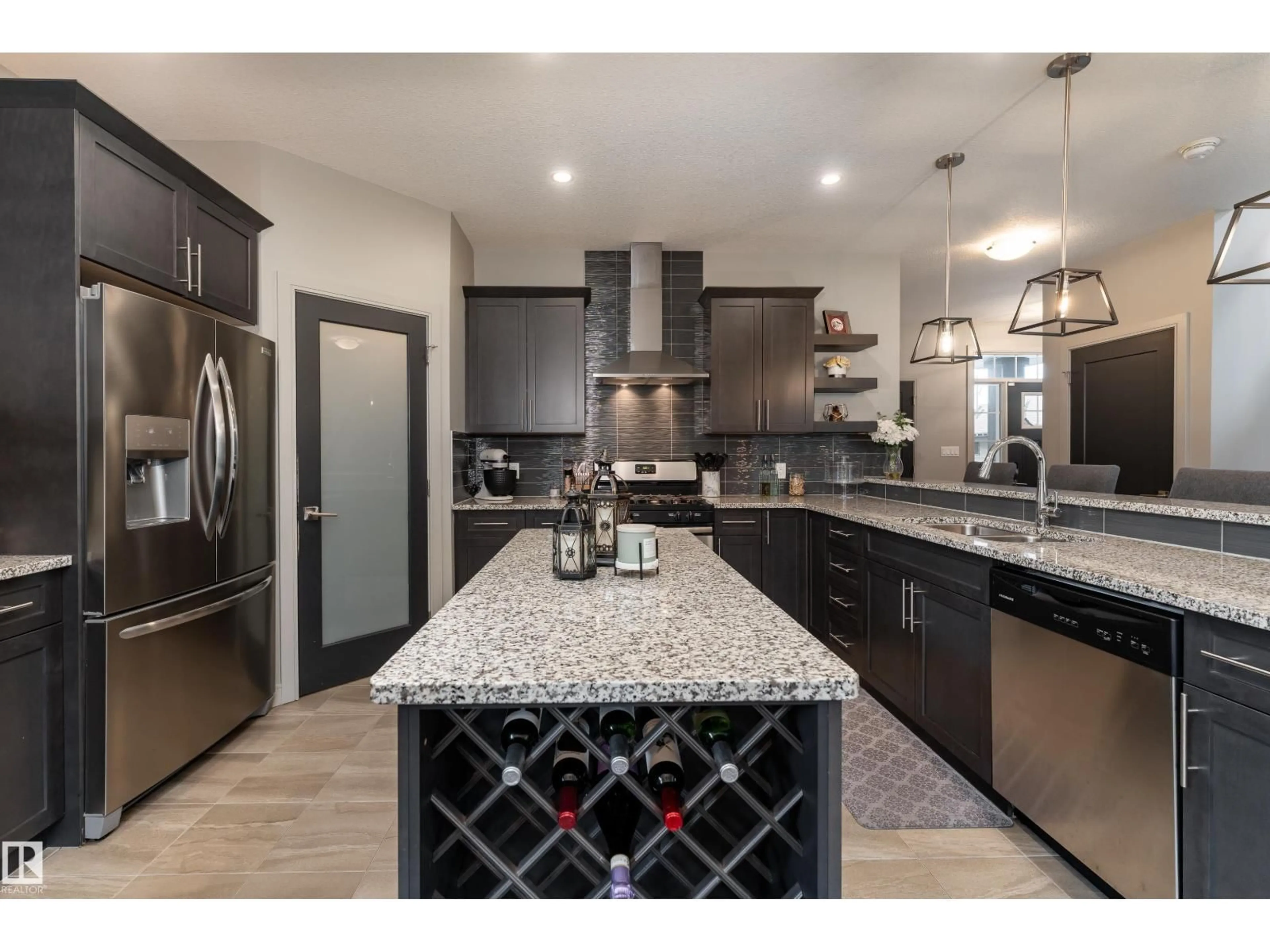 Open concept kitchen, ceramic/tile floor for 7038 172A AV, Edmonton Alberta T5Z0M9
