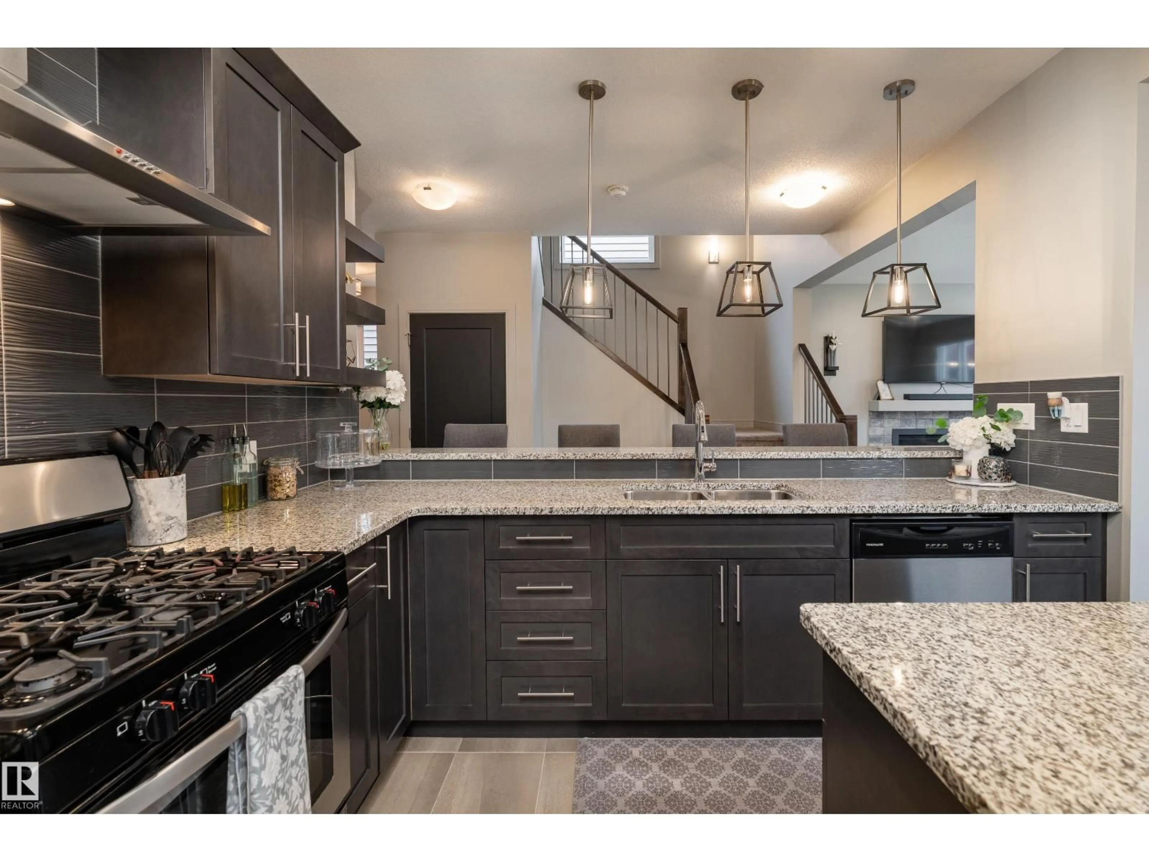 Open concept kitchen, ceramic/tile floor for 7038 172A AV, Edmonton Alberta T5Z0M9
