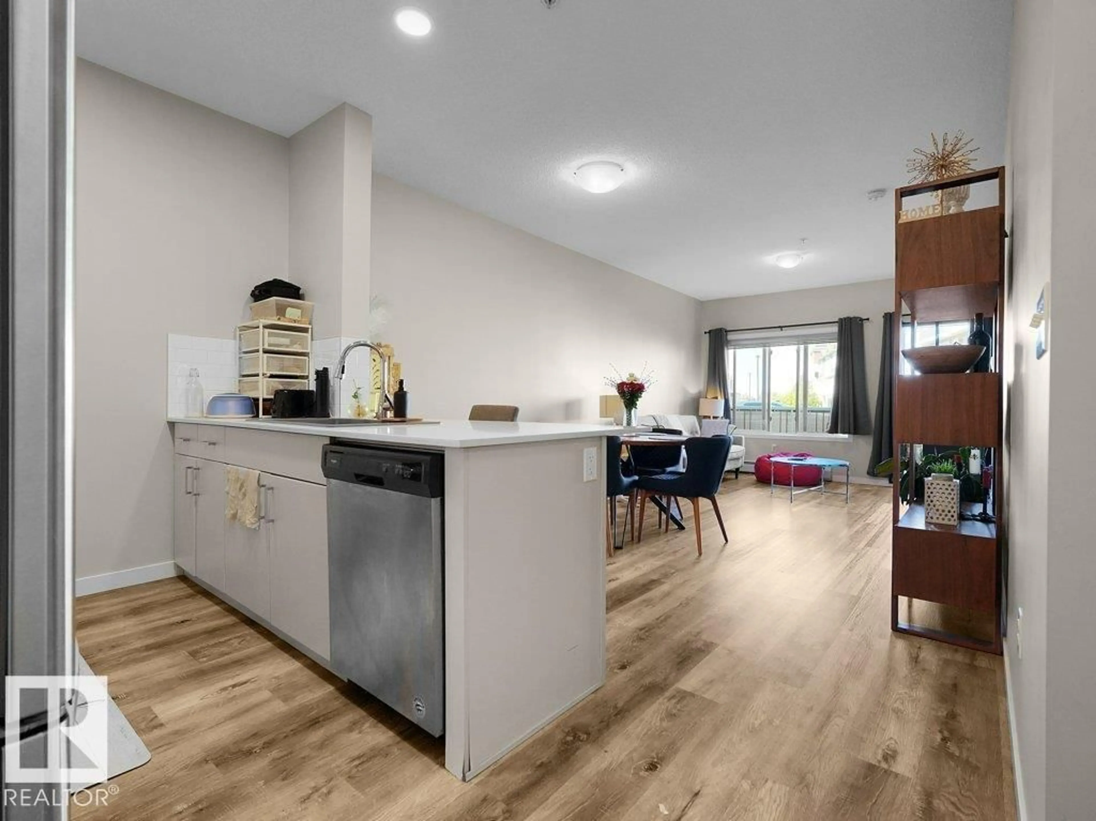 Open concept kitchen, wood/laminate floor for #151 - 1818 RUTHERFORD RD, Edmonton Alberta T6W2K6