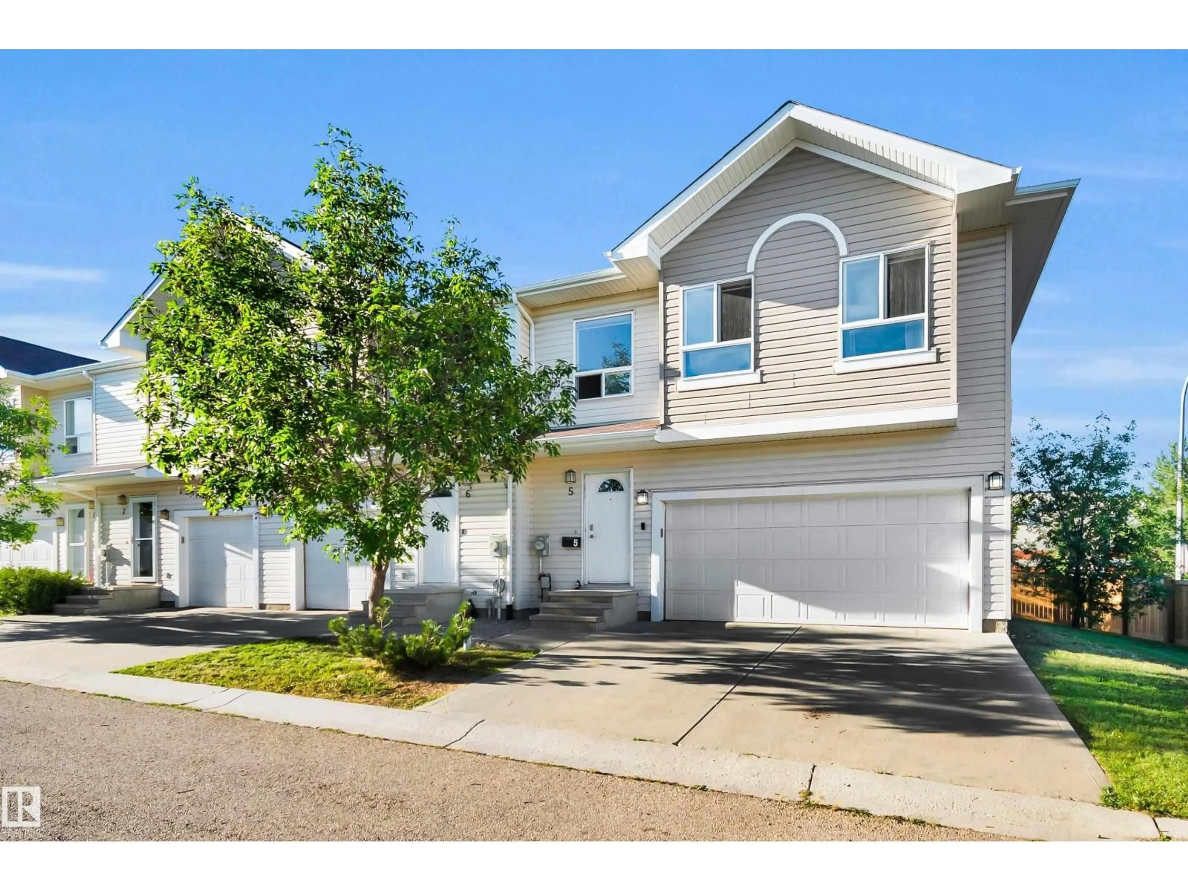 Home with vinyl exterior material, street for 5 - 5120 164 AV, Edmonton Alberta T5Y0L7