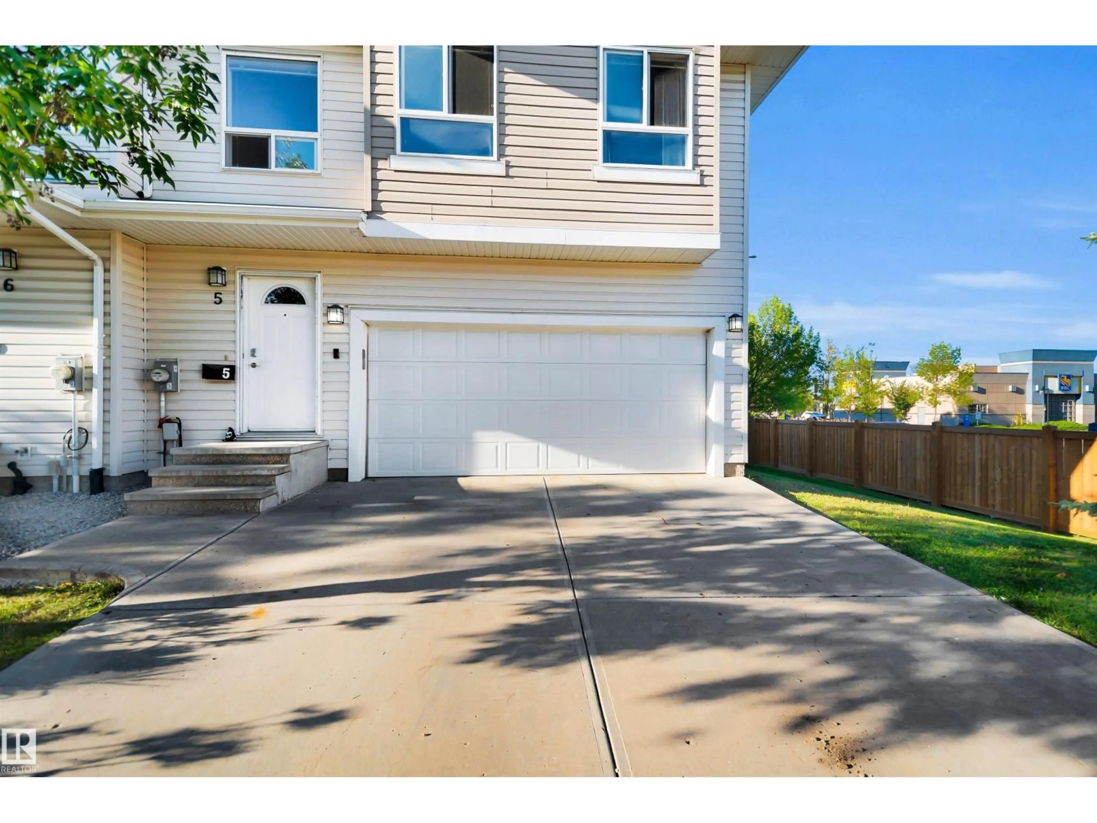Home with vinyl exterior material, street for 5 - 5120 164 AV, Edmonton Alberta T5Y0L7