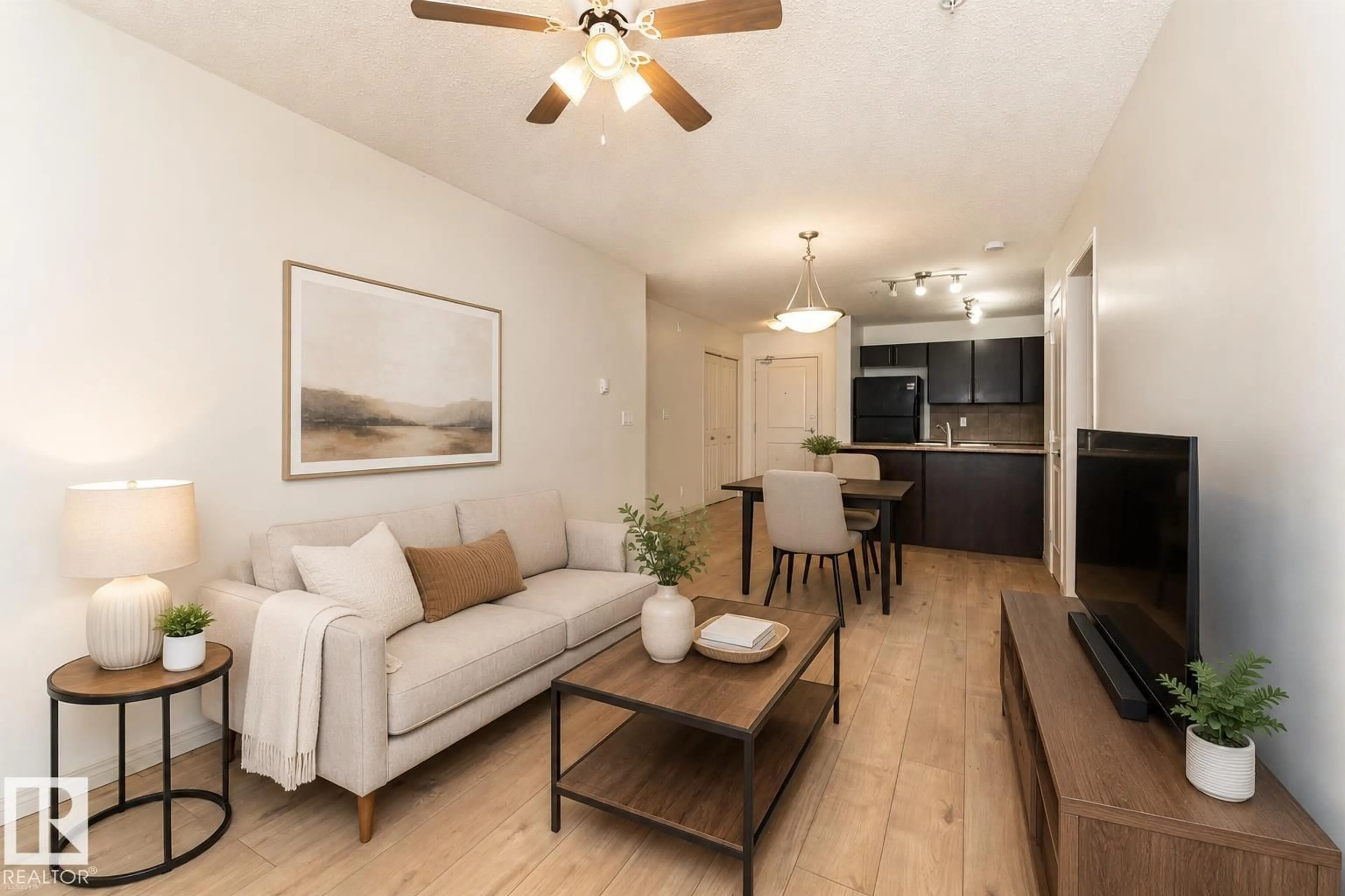 Living room with furniture, wood/laminate floor for #108 - 103 AMBLESIDE DR, Edmonton Alberta T6W0J4