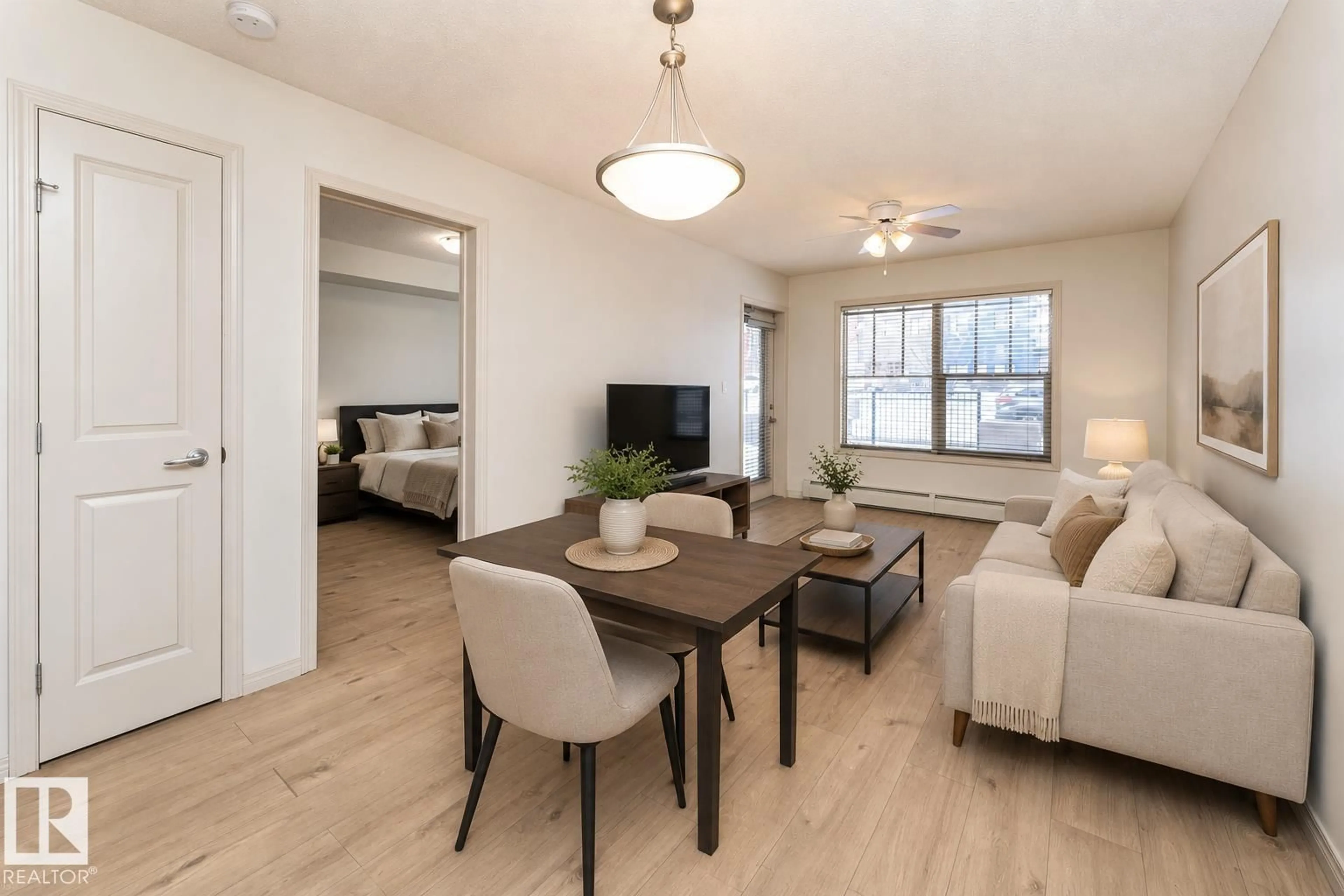 Living room with furniture, wood/laminate floor for #108 - 103 AMBLESIDE DR, Edmonton Alberta T6W0J4