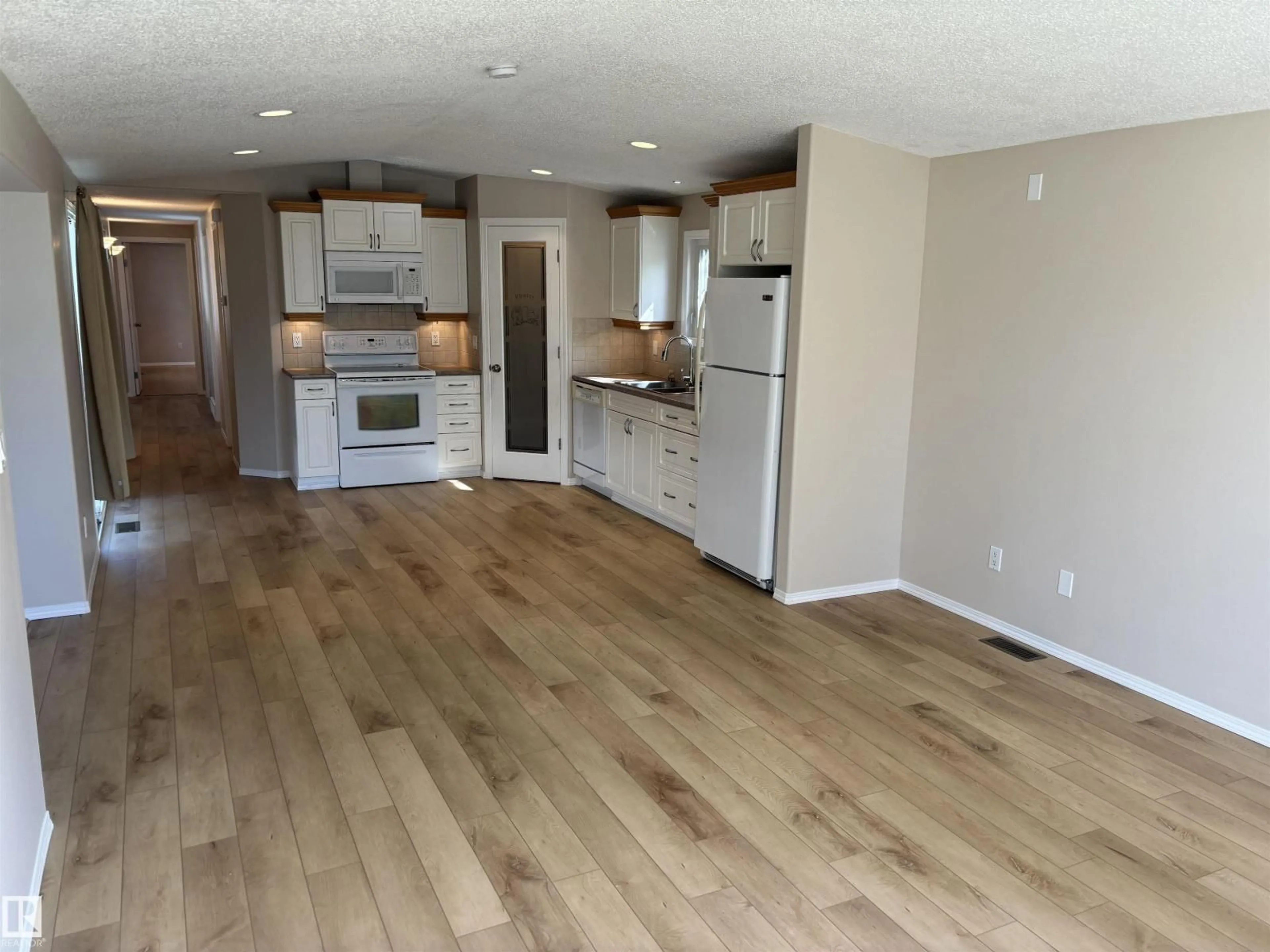 Open concept kitchen, wood/laminate floor for 56 RIM RD, Edmonton Alberta T6P1C2