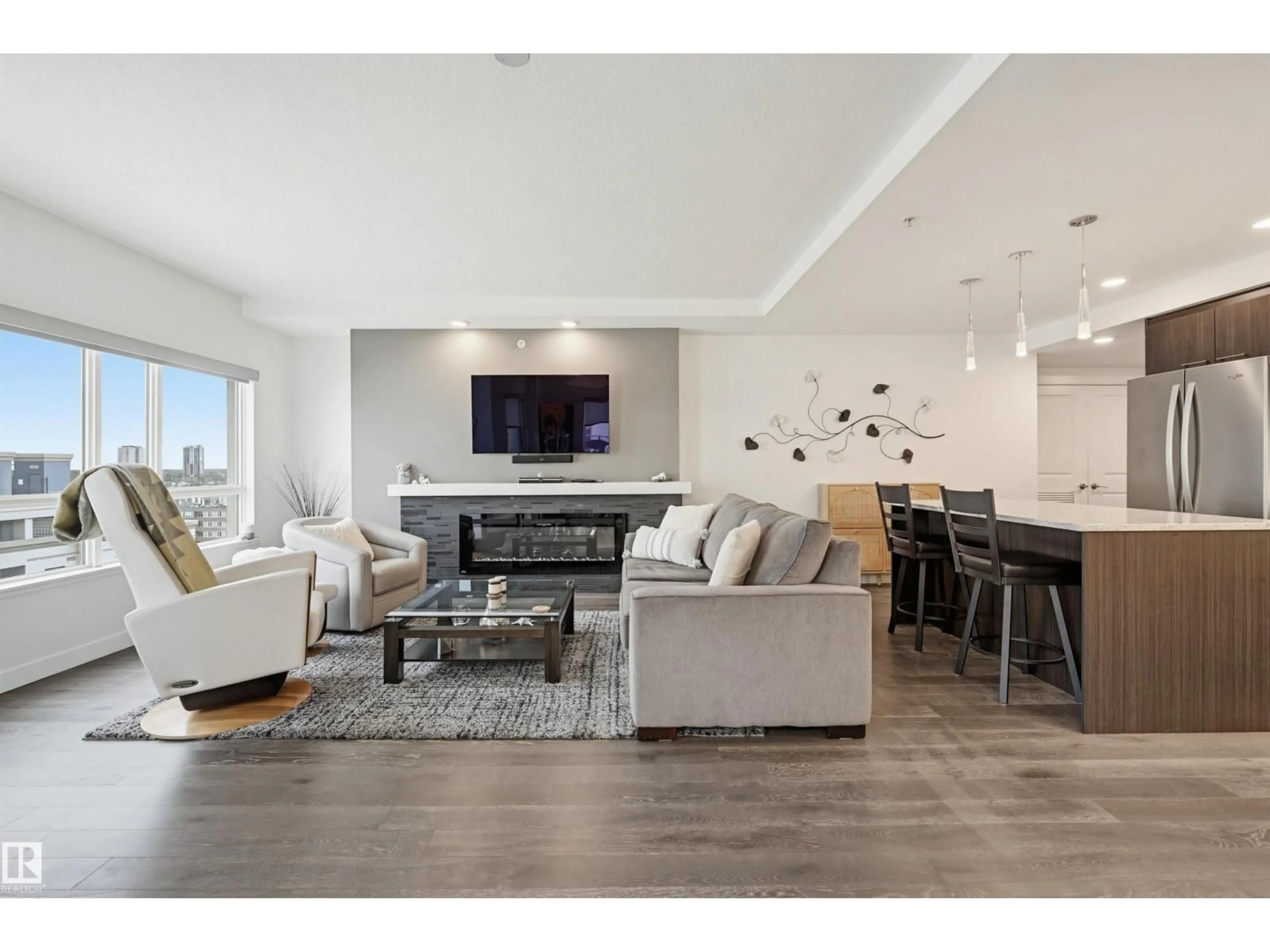 Living room with furniture, wood/laminate floor for 1304 106 ST, Edmonton Alberta T5K0K8