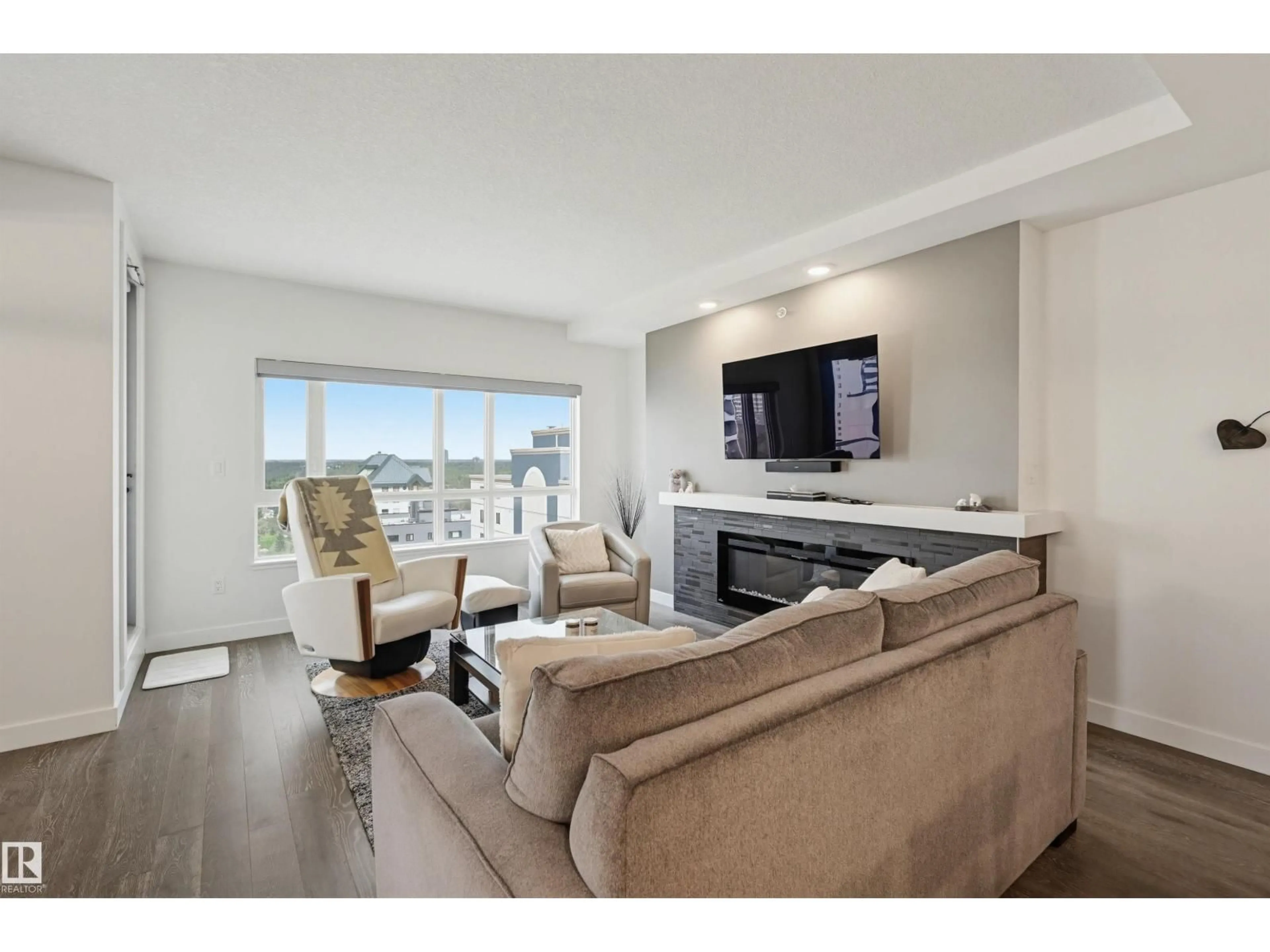 Living room with furniture, wood/laminate floor for 1304 106 ST, Edmonton Alberta T5K0K8