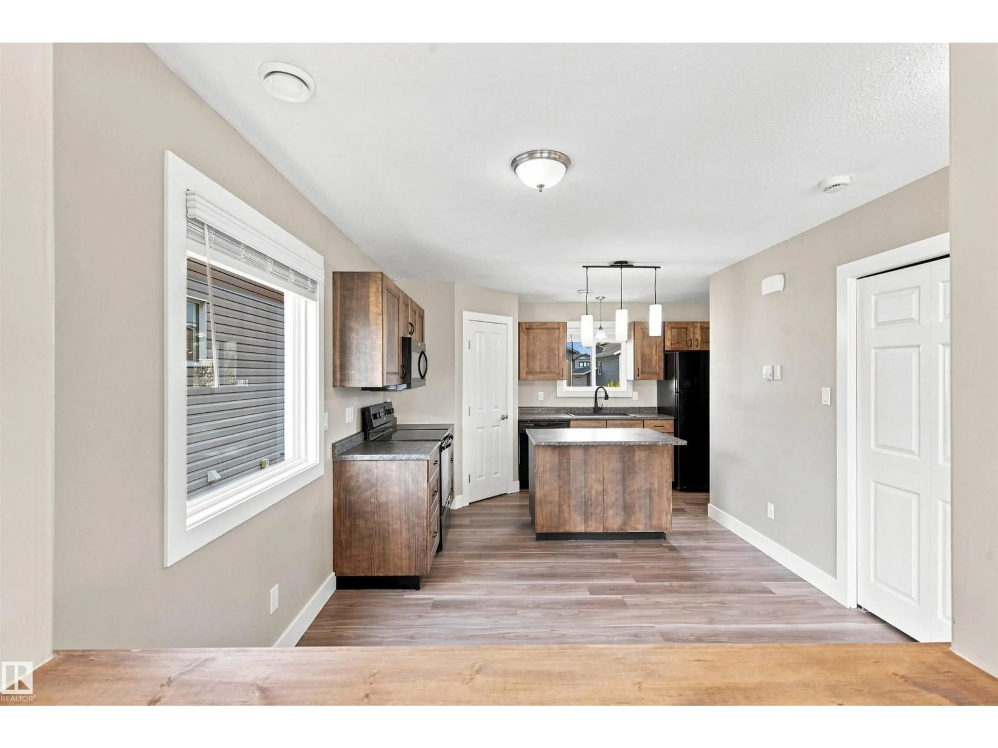 Open concept kitchen, wood/laminate floor for 109 26 ST, Cold Lake Alberta T9M0E3