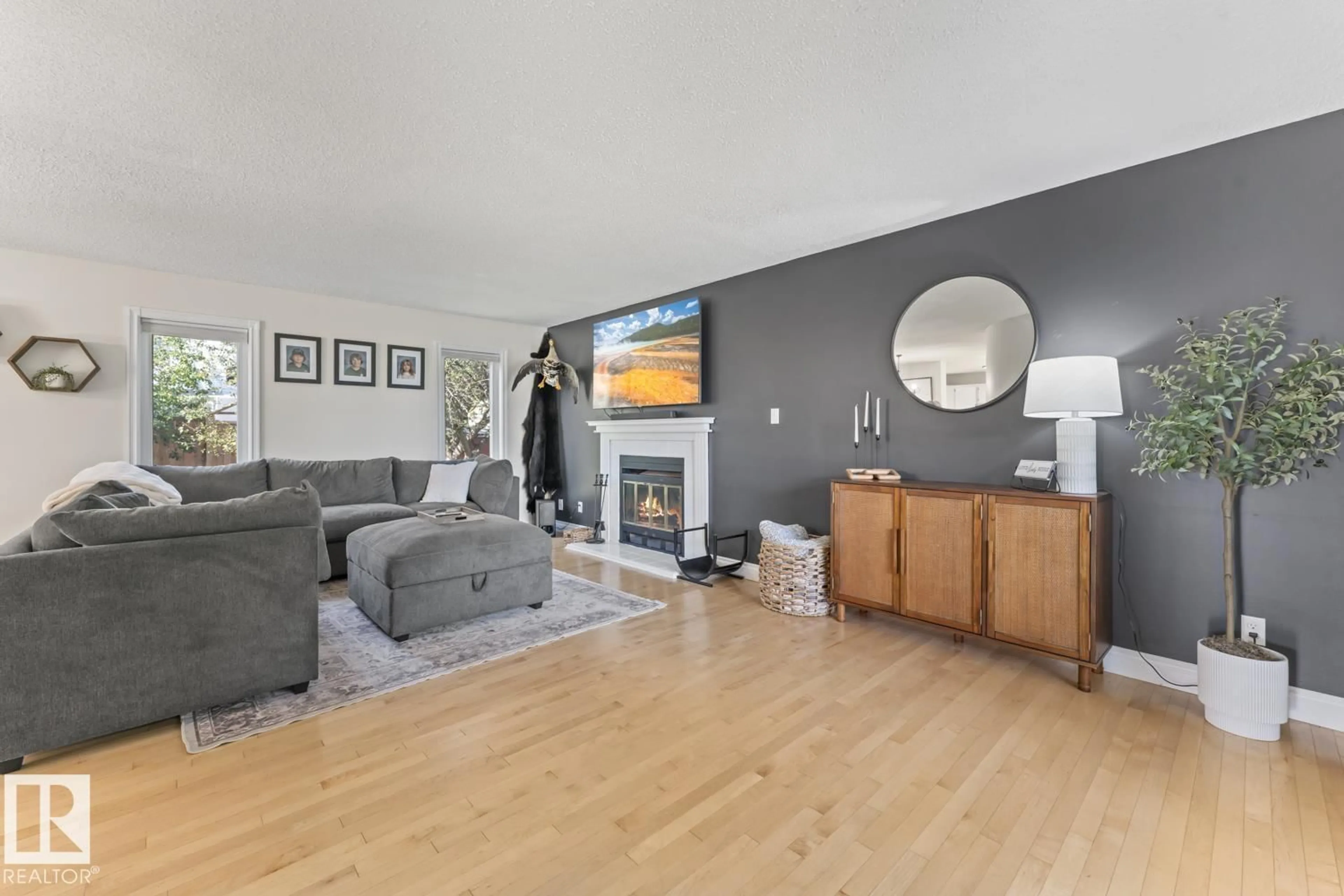 Living room with furniture, wood/laminate floor for 215 18 ST, Cold Lake Alberta T9M1B6