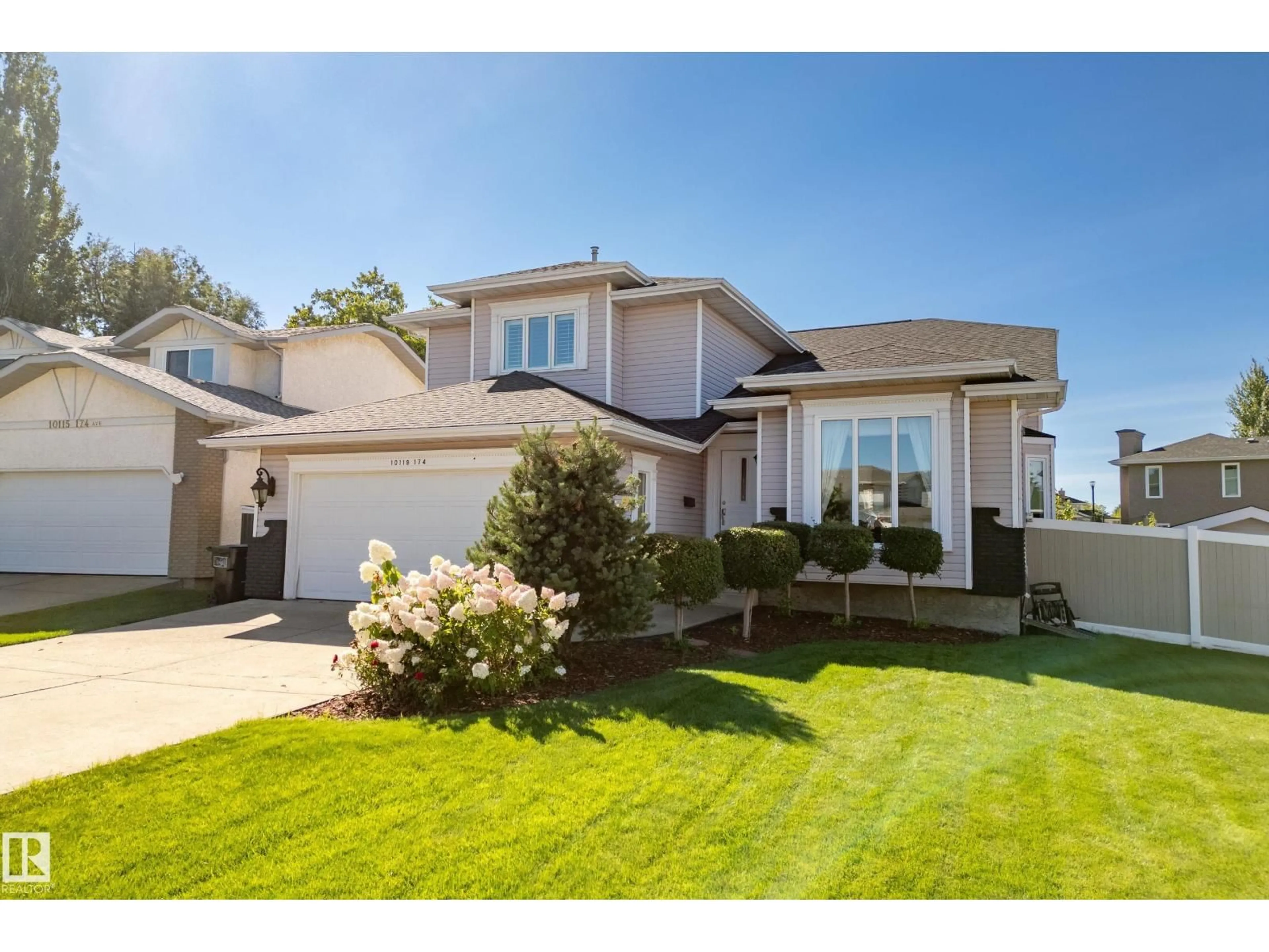 Home with vinyl exterior material, street for 10119 174 AV, Edmonton Alberta T5X5W3