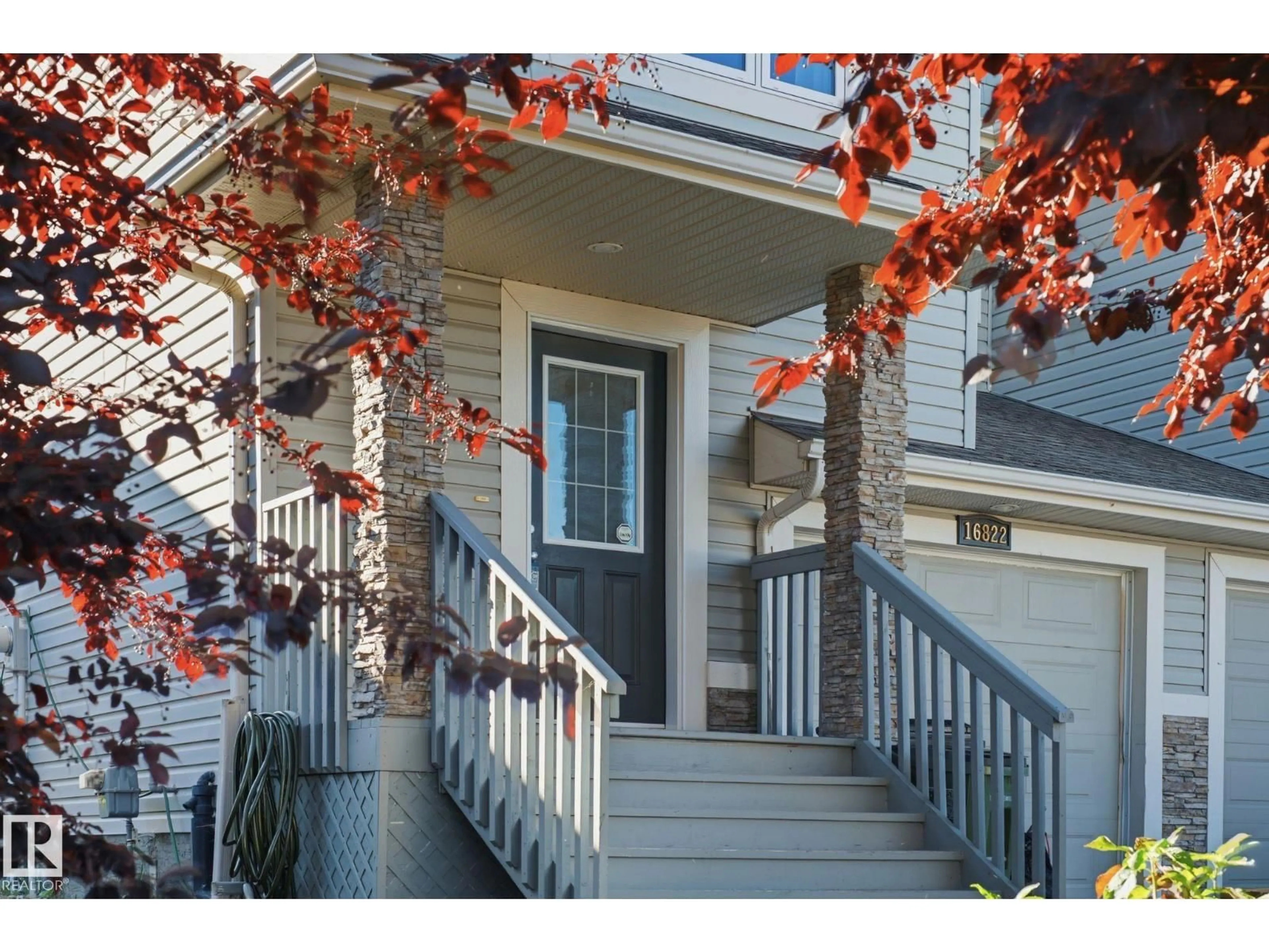 Home with vinyl exterior material, street for NW - 16822 52 ST, Edmonton Alberta T5Y0R9