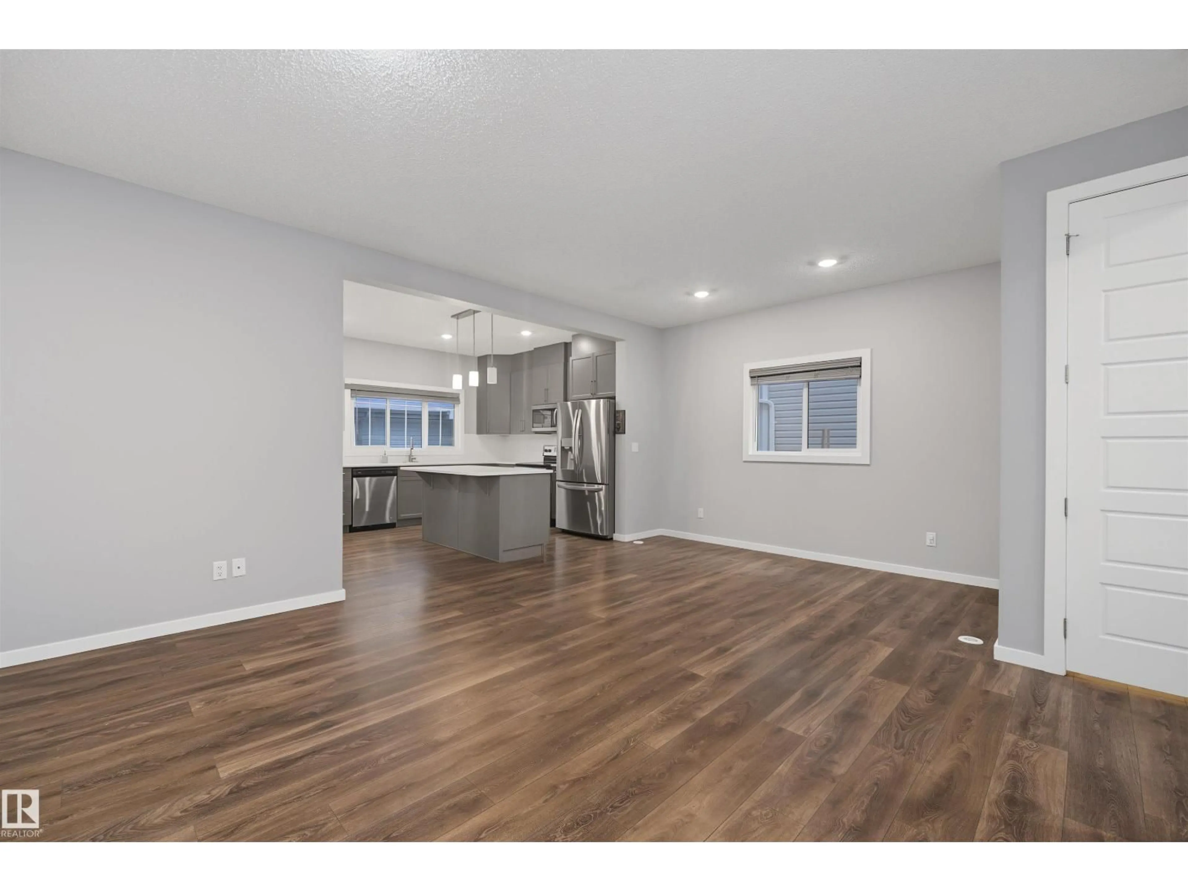 Open concept kitchen, wood/laminate floor for 1825 25A ST, Edmonton Alberta T6T2H7