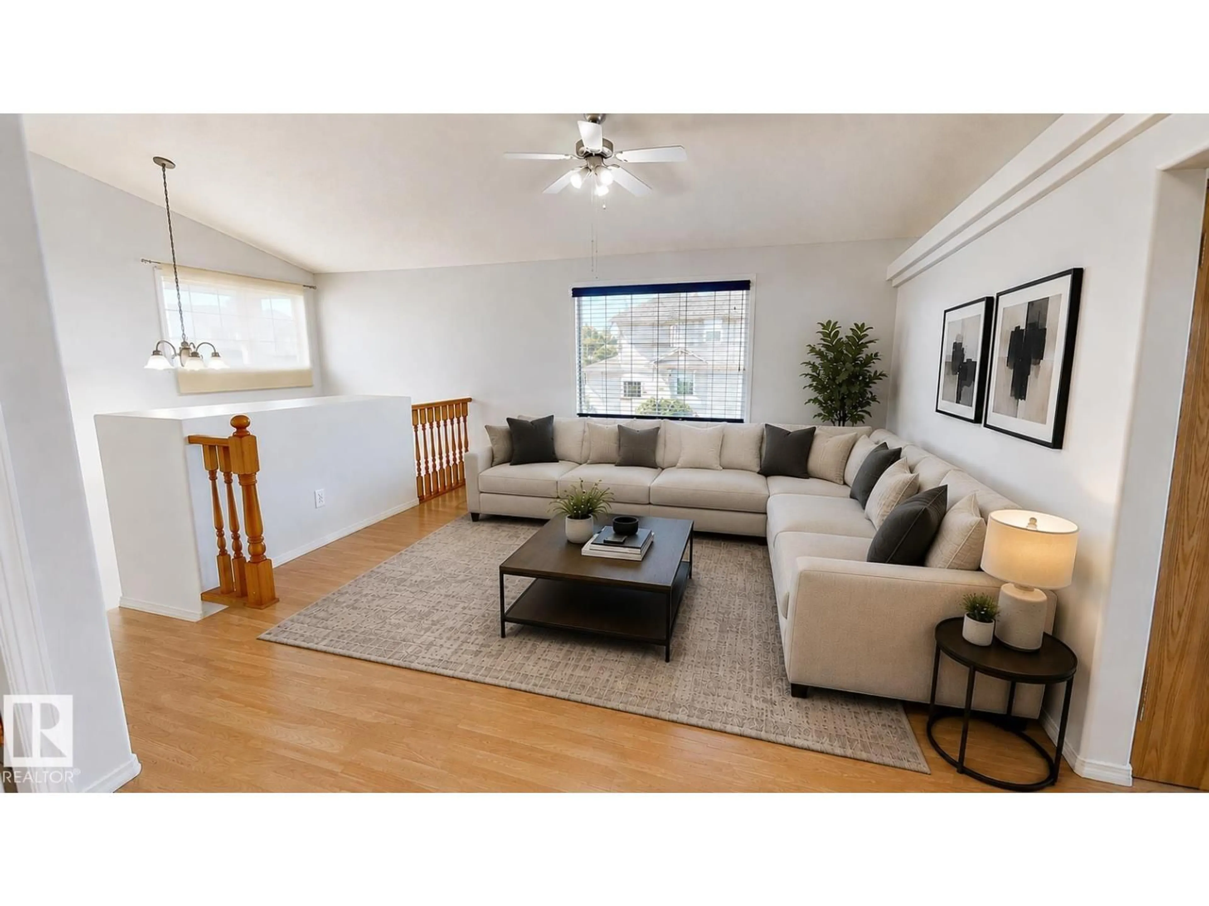 Living room with furniture, wood/laminate floor for 7936 3 AV, Edmonton Alberta T6X1K6