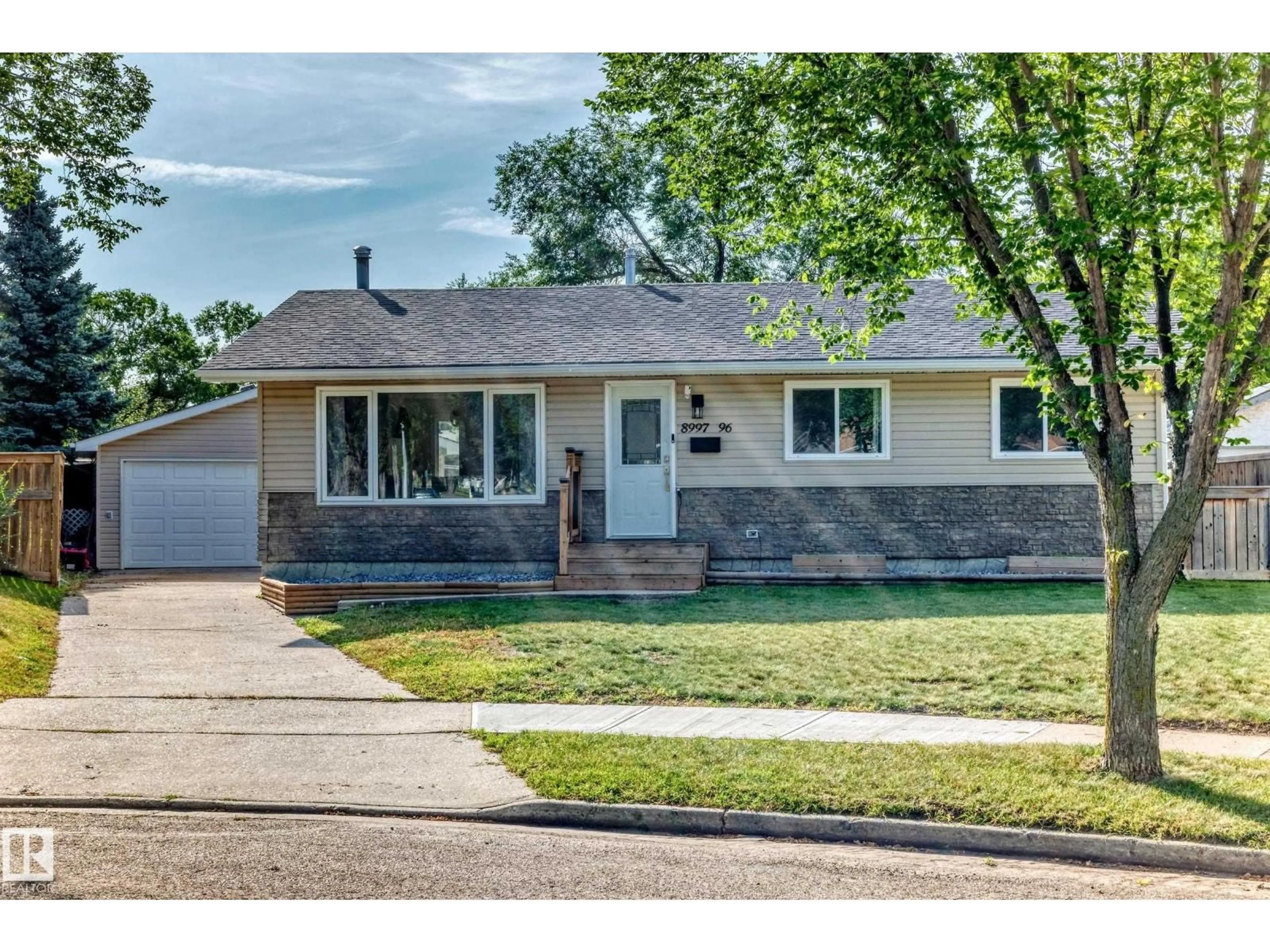Home with vinyl exterior material, street for 8997 96 AVE, Fort Saskatchewan Alberta T8L1E3