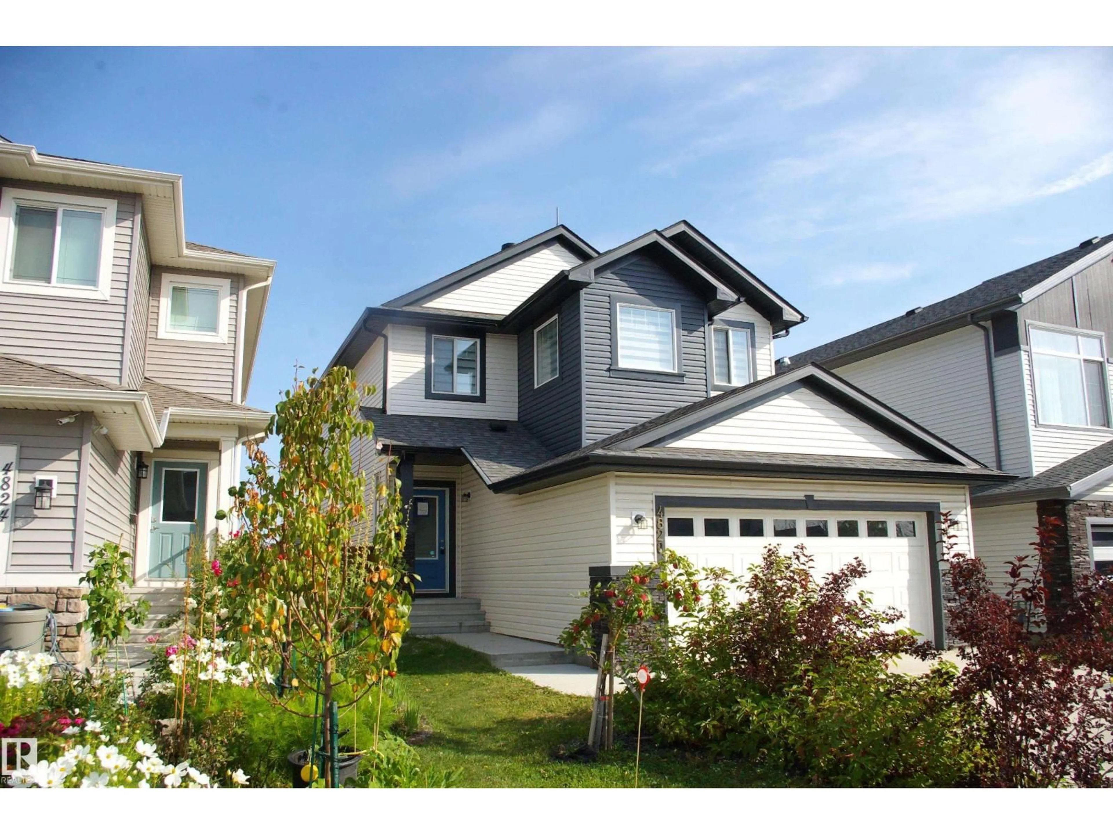 Home with vinyl exterior material, street for 4820 175 AV, Edmonton Alberta T5Y4C6