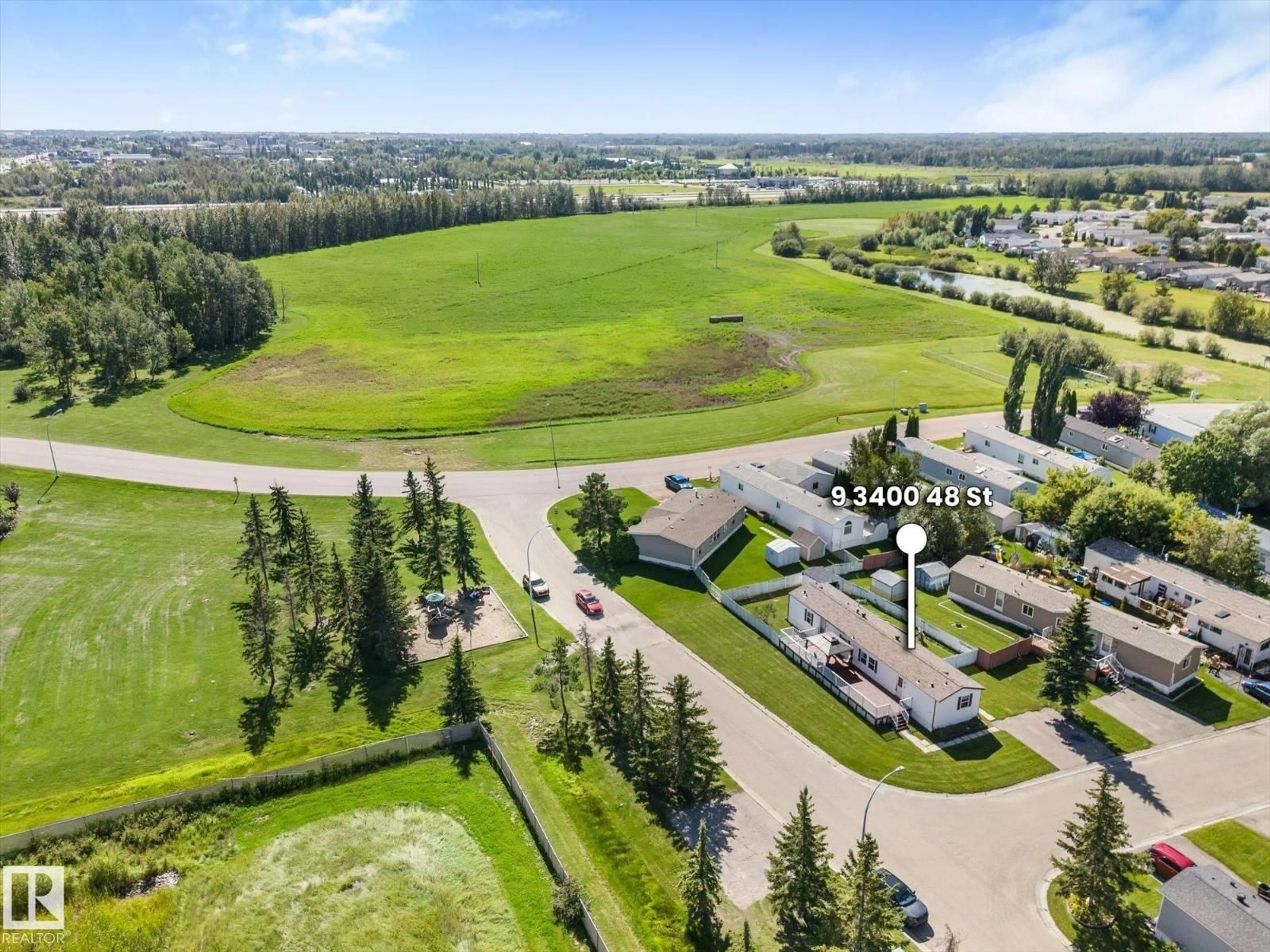 A pic from outside/outdoor area/front of a property/back of a property/a pic from drone, unknown for 9 - 3400 48 ST, Stony Plain Alberta T7Z1R9