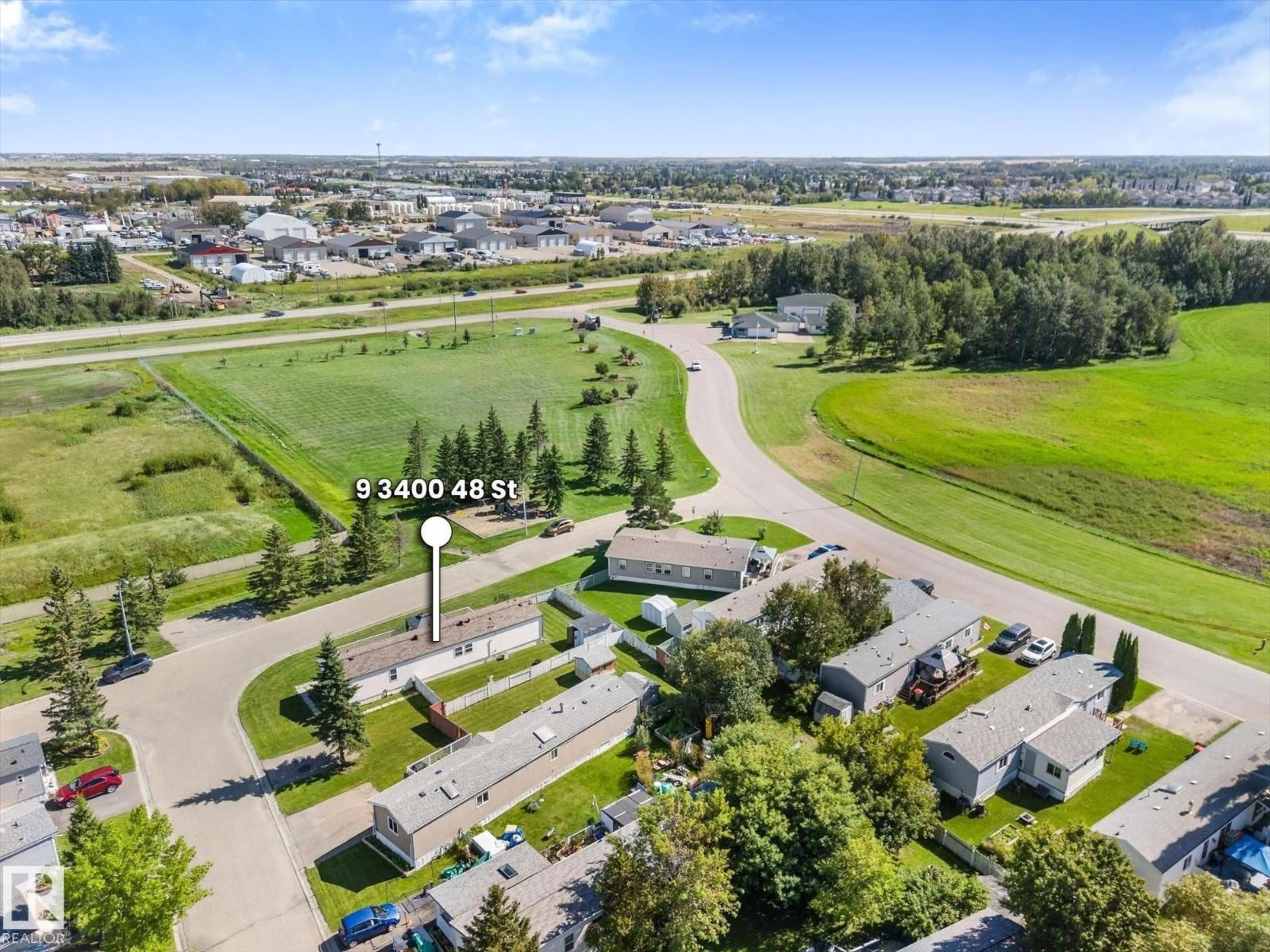 A pic from outside/outdoor area/front of a property/back of a property/a pic from drone, mountain view for 9 - 3400 48 ST, Stony Plain Alberta T7Z1R9