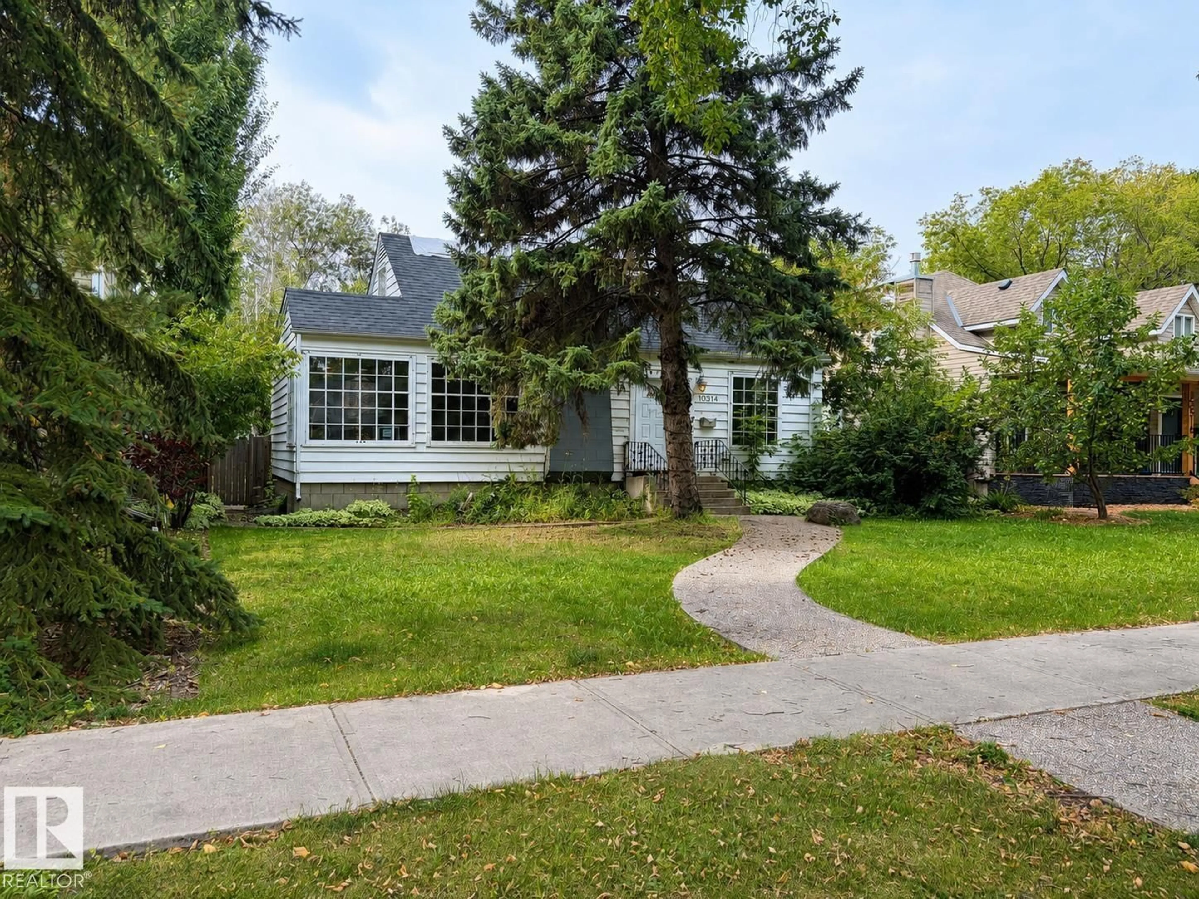 Home with vinyl exterior material, street for NW - 10314 137 ST, Edmonton Alberta T5N2H1