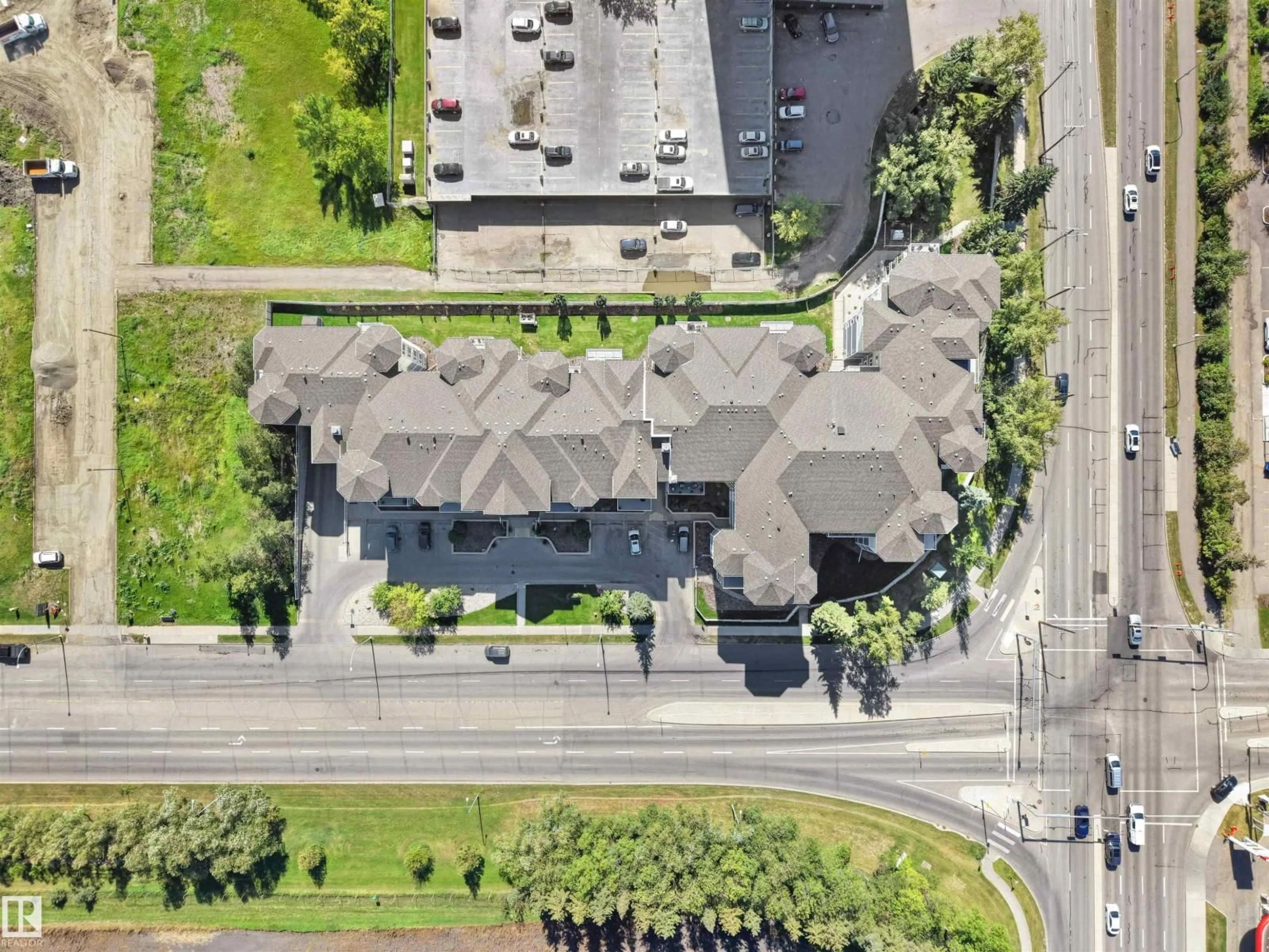 A pic from outside/outdoor area/front of a property/back of a property/a pic from drone, street for #206 - 12111 51 AV, Edmonton Alberta T6H6A3