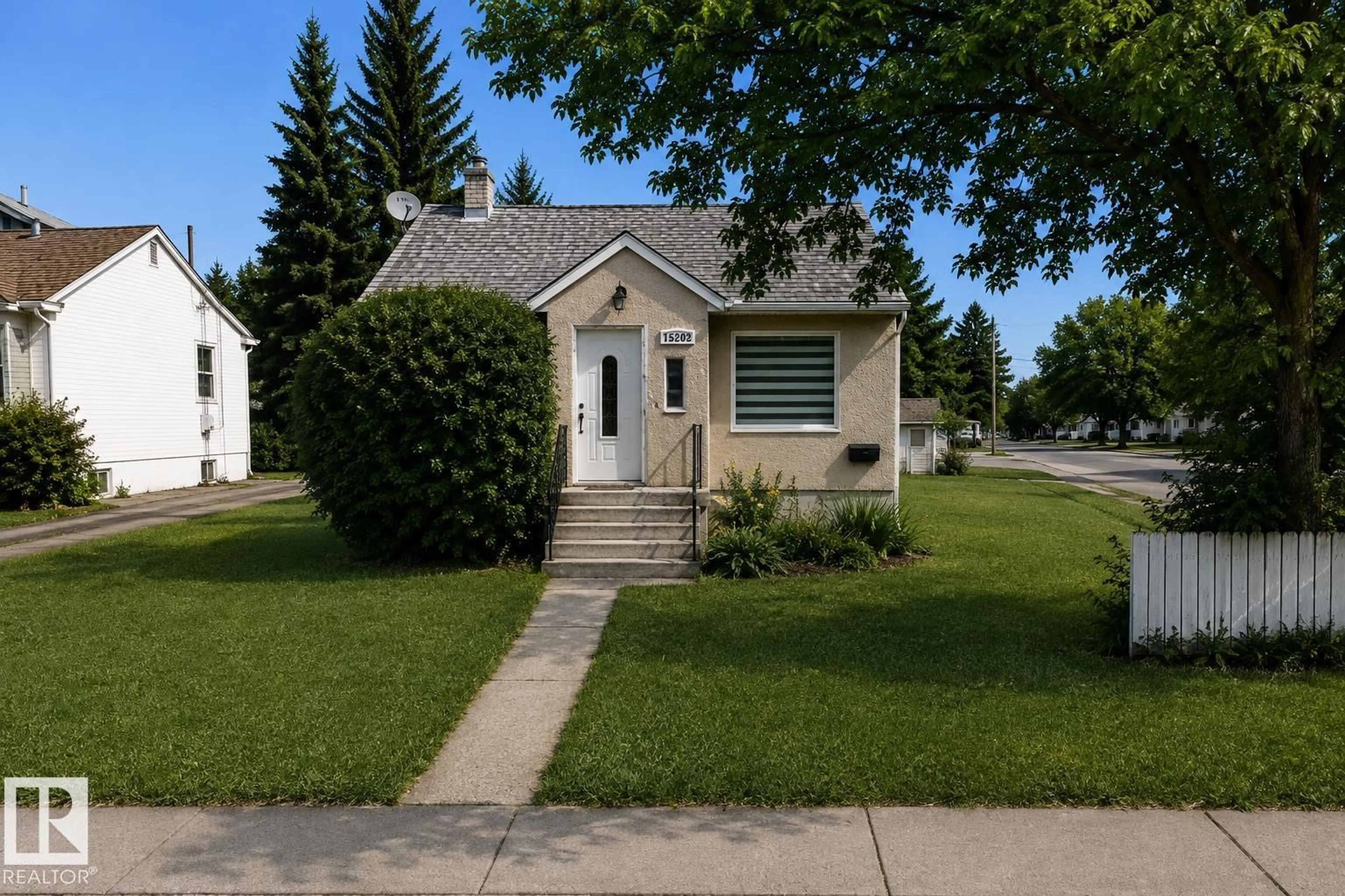 Home with vinyl exterior material, street for 15202 98 AV, Edmonton Alberta T5P0G4
