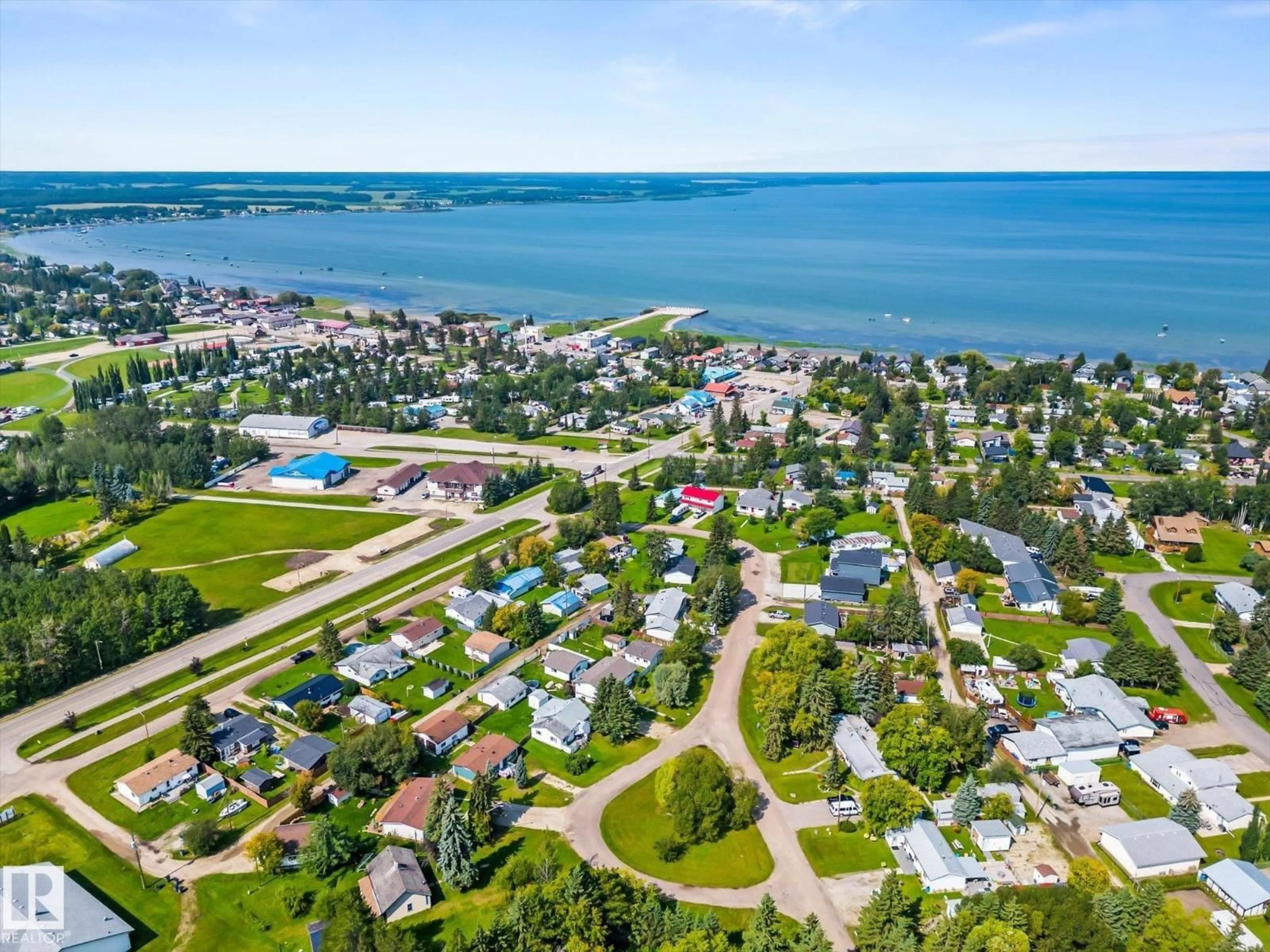 A pic from outside/outdoor area/front of a property/back of a property/a pic from drone, water/lake/river/ocean view for 4532 46B ST, Rural Lac Ste. Anne County Alberta T0E0A0