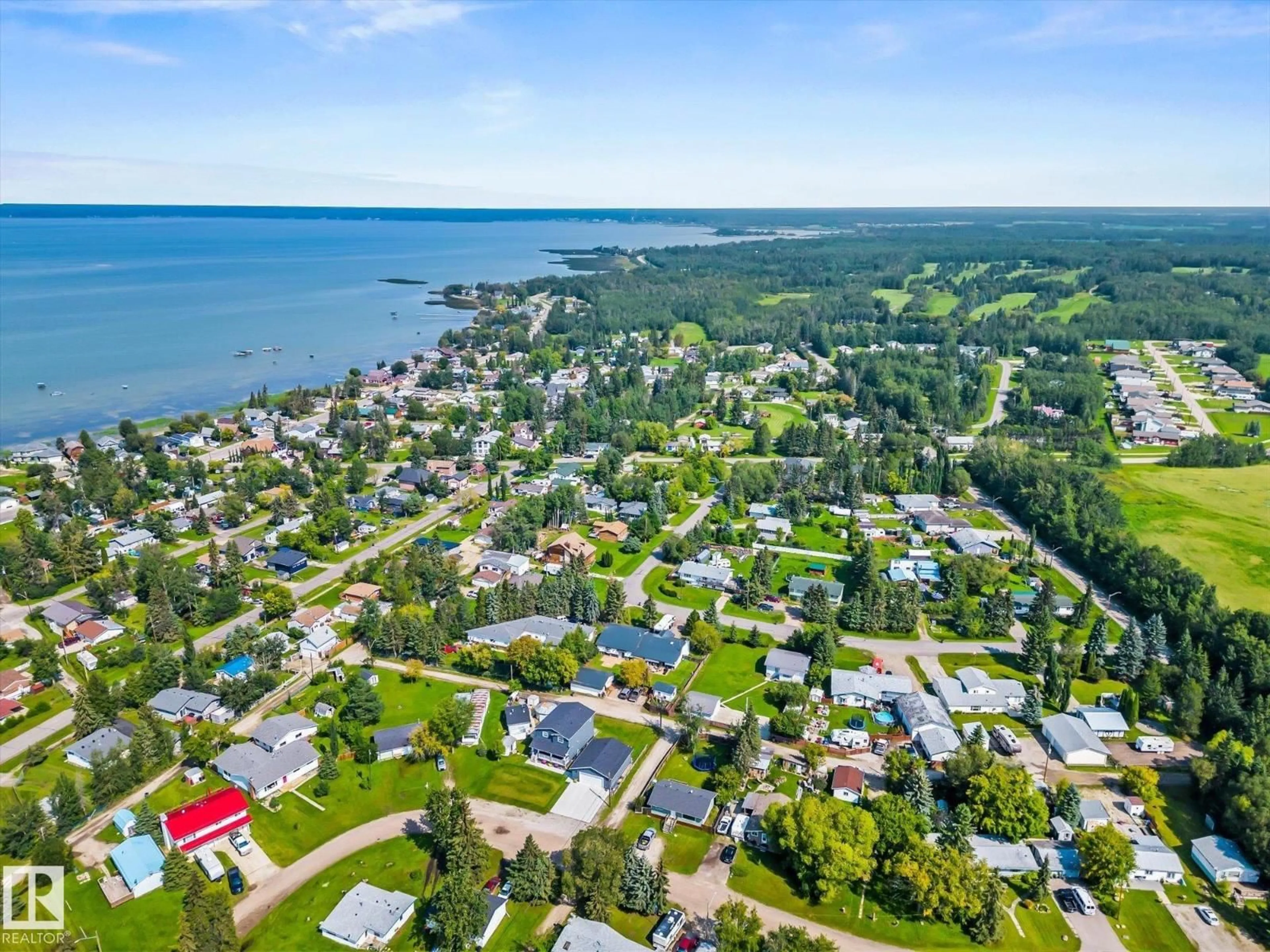 A pic from outside/outdoor area/front of a property/back of a property/a pic from drone, water/lake/river/ocean view for 4532 46B ST, Rural Lac Ste. Anne County Alberta T0E0A0