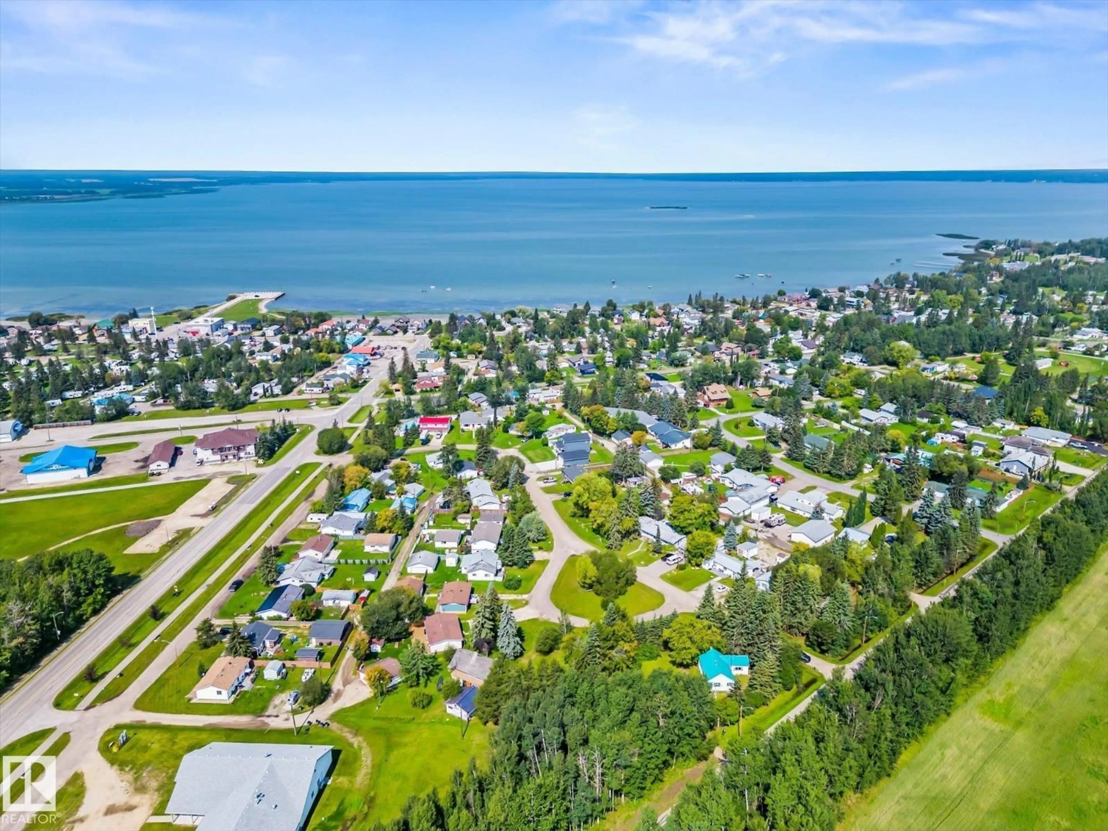 A pic from outside/outdoor area/front of a property/back of a property/a pic from drone, water/lake/river/ocean view for 4532 46B ST, Rural Lac Ste. Anne County Alberta T0E0A0