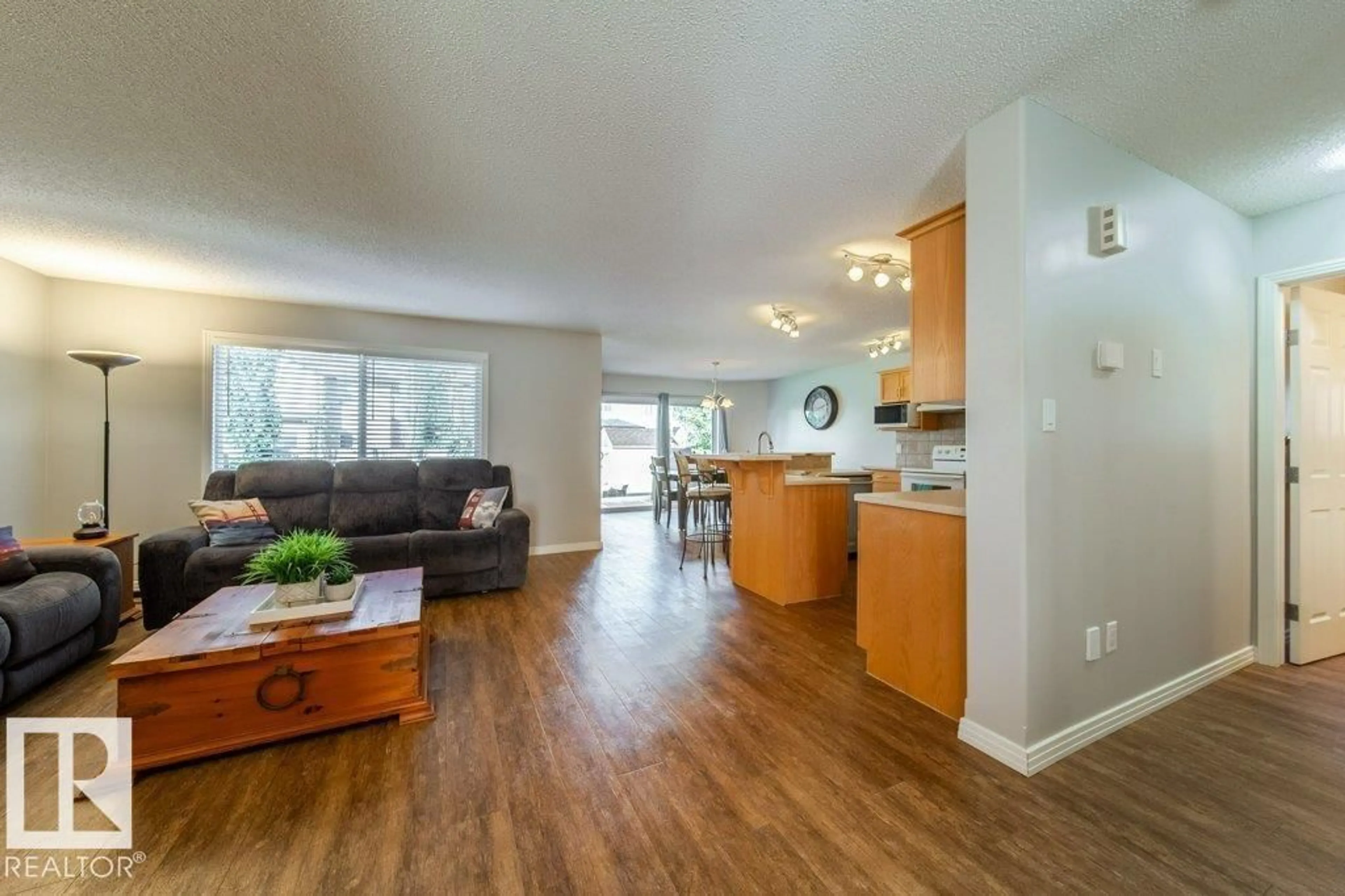 Open concept kitchen, wood/laminate floor for NW - 16120 138 ST, Edmonton Alberta T6V0E2