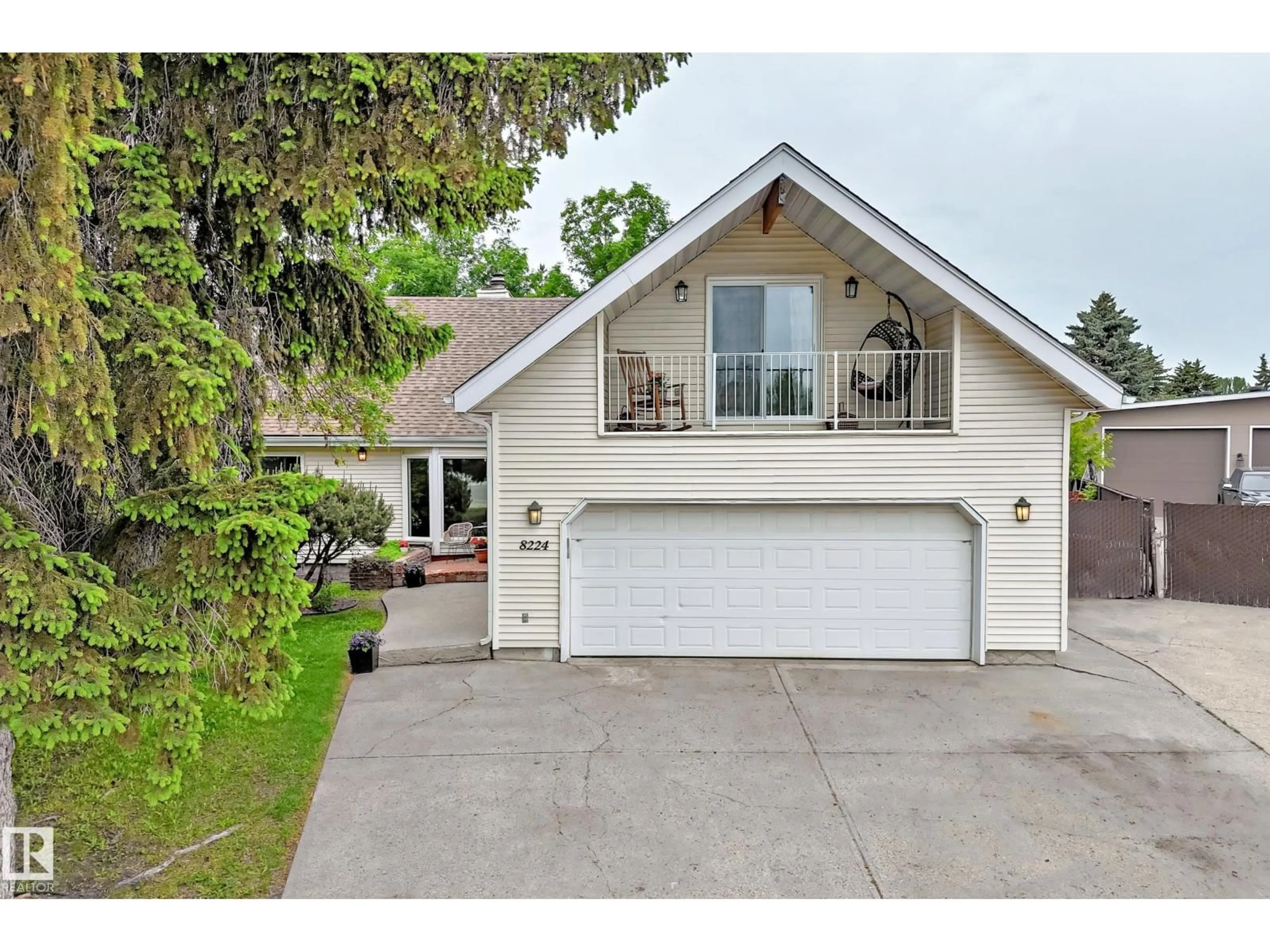 Home with vinyl exterior material, street for NW - 8224 186 ST, Edmonton Alberta T5T1H4