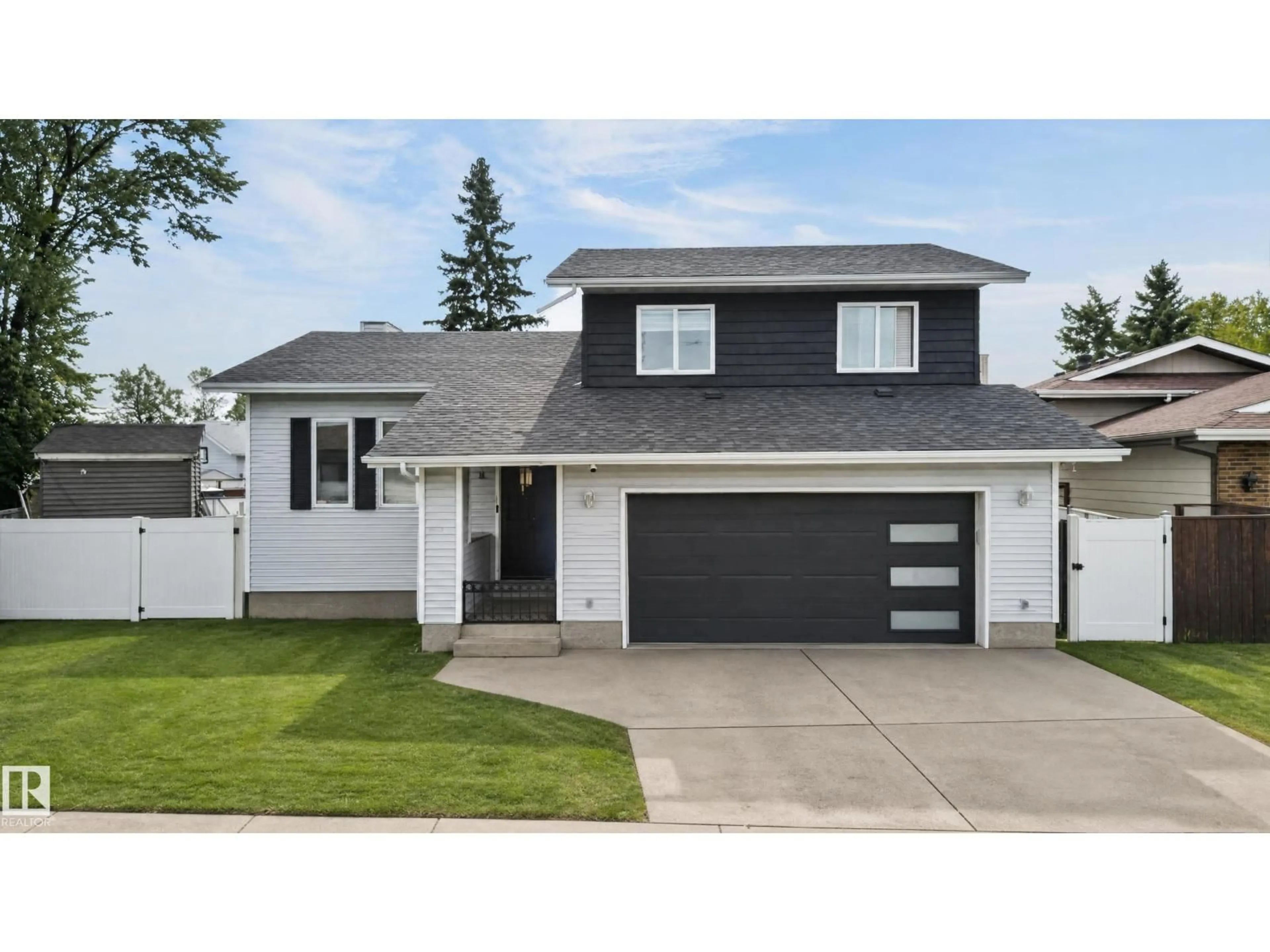 Home with vinyl exterior material, street for NW - 17103 92 ST, Edmonton Alberta T5Z2N1