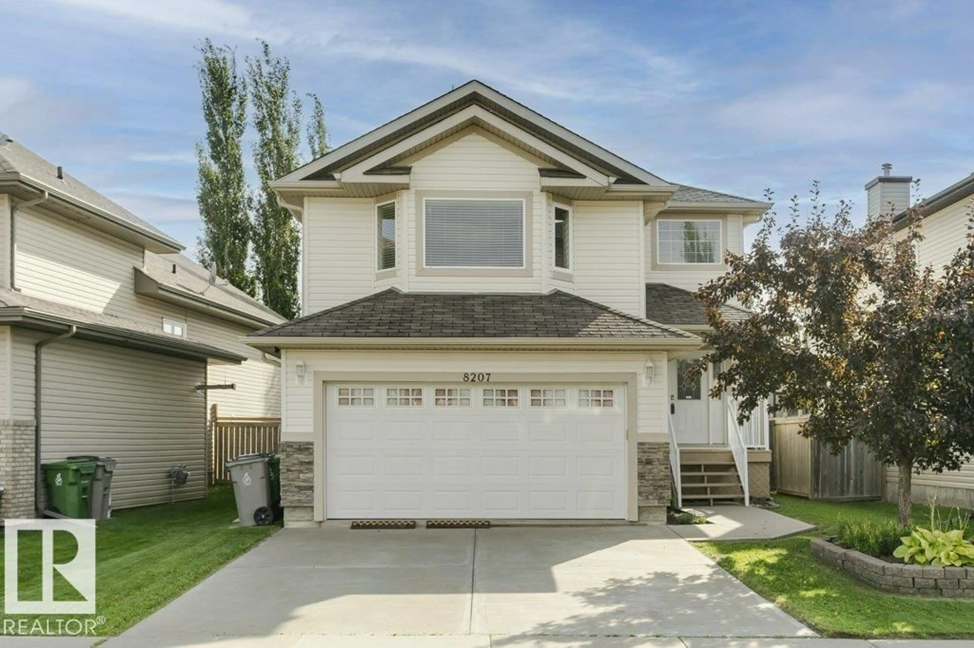Home with vinyl exterior material, street for 8207 96 ST, Morinville Alberta T8R1W2