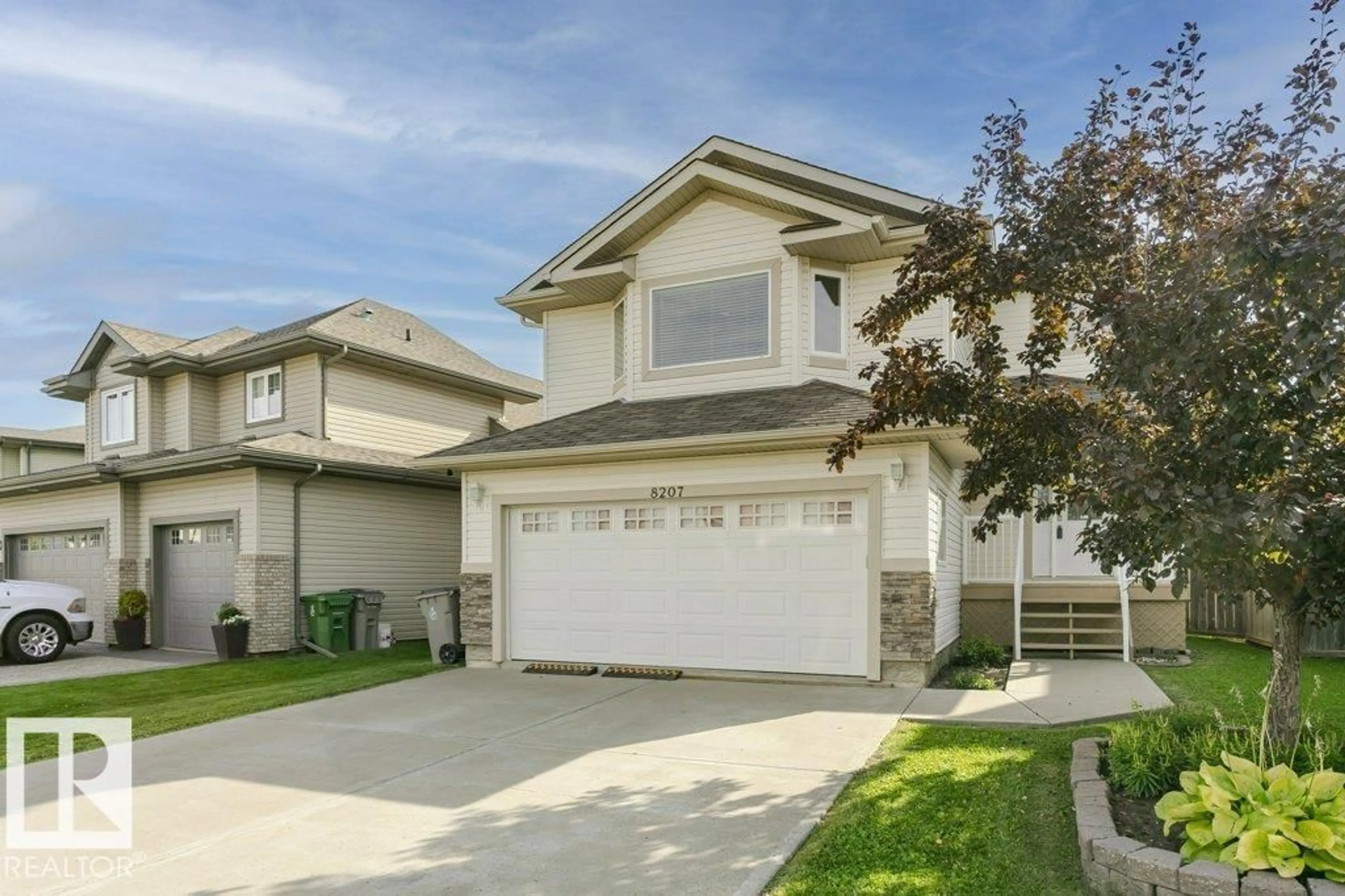 Home with vinyl exterior material, street for 8207 96 ST, Morinville Alberta T8R1W2