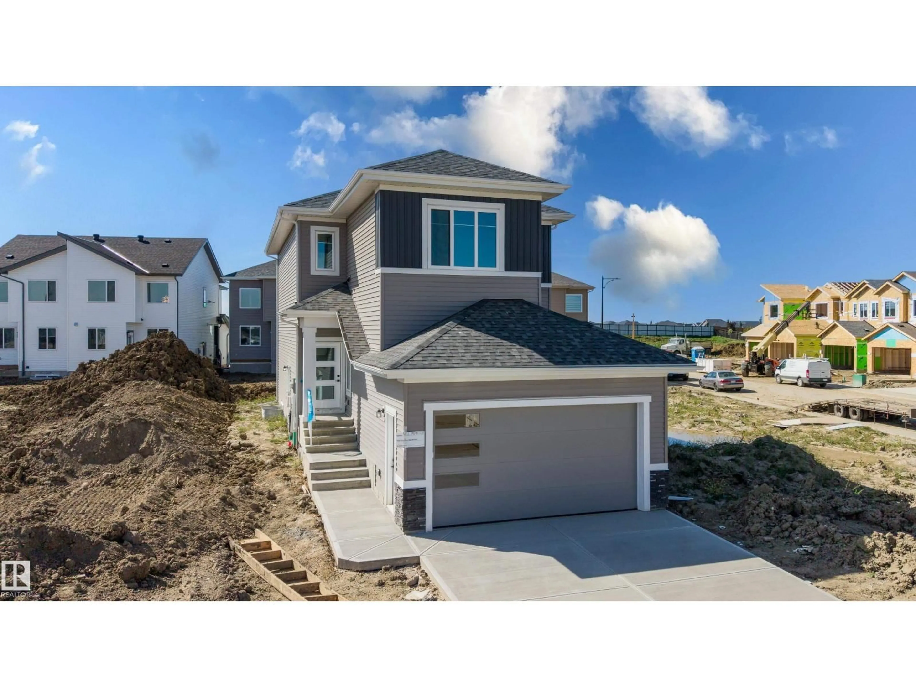 Home with vinyl exterior material, street for 402 MUNN, Leduc Alberta T9E0J9