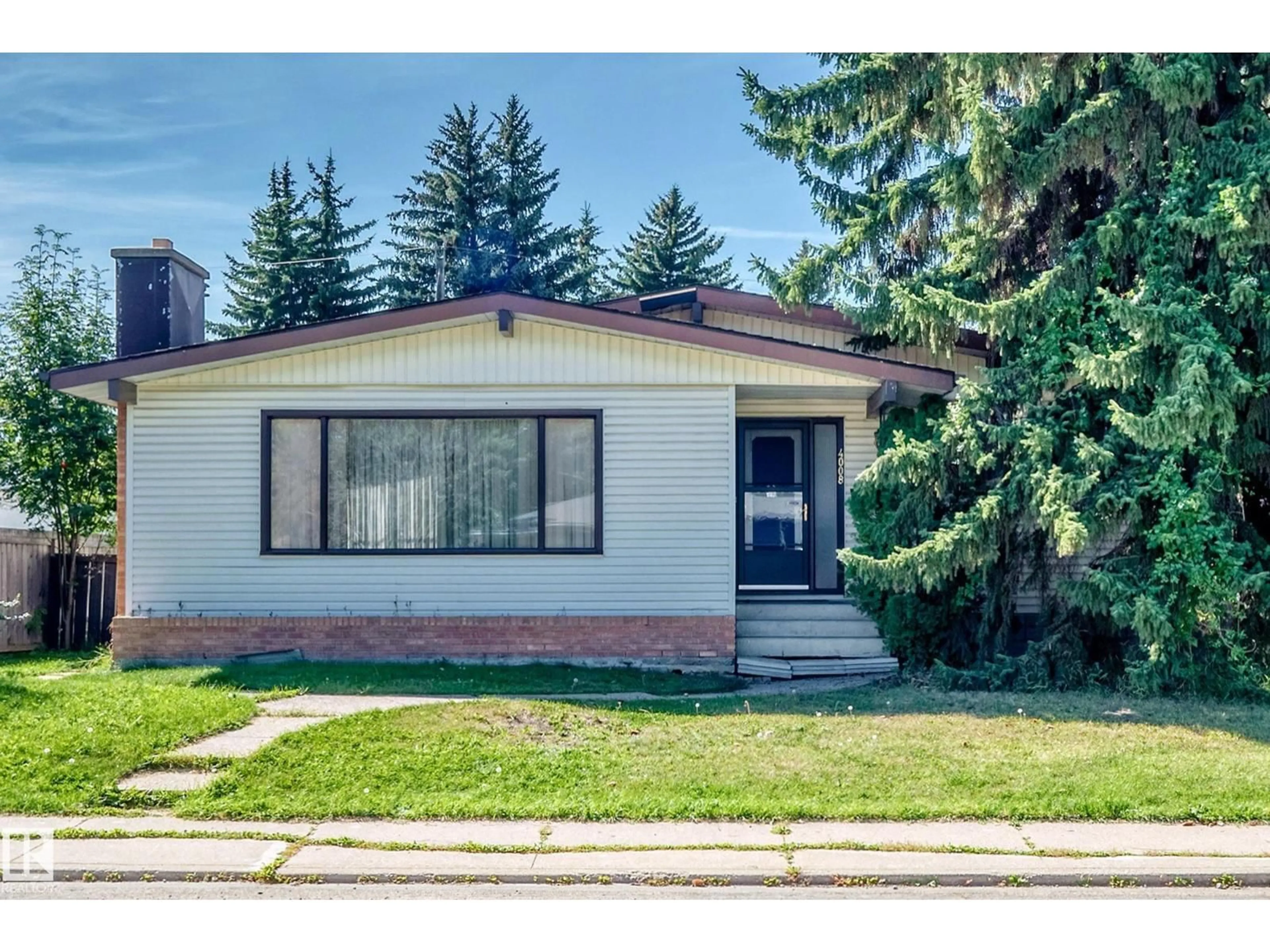 Home with brick exterior material, street for NW - 4008 124 ST, Edmonton Alberta T6J1Z9