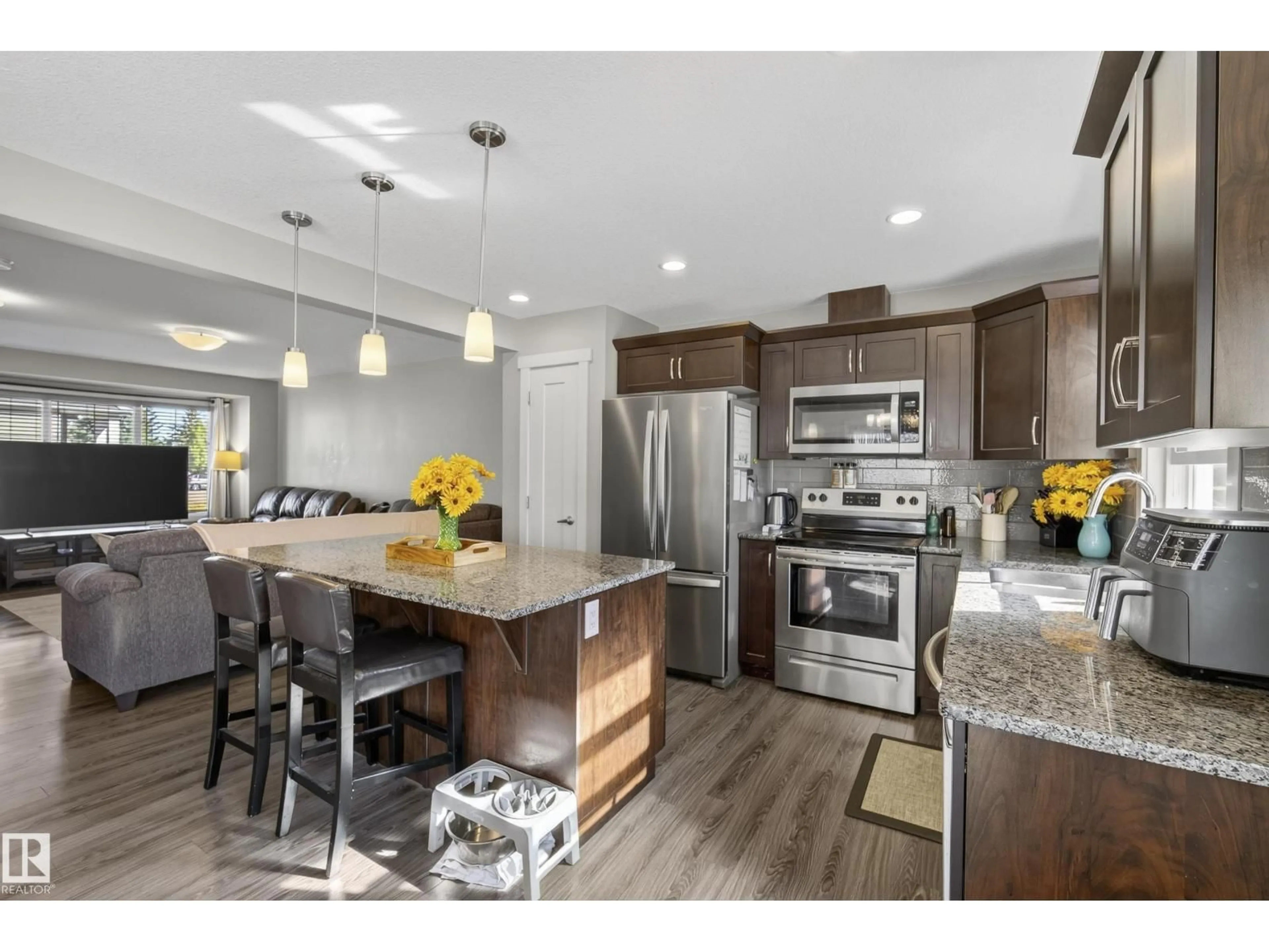 Open concept kitchen, wood/laminate floor for #8 - 4205 30 ST, Edmonton Alberta T6T2G9